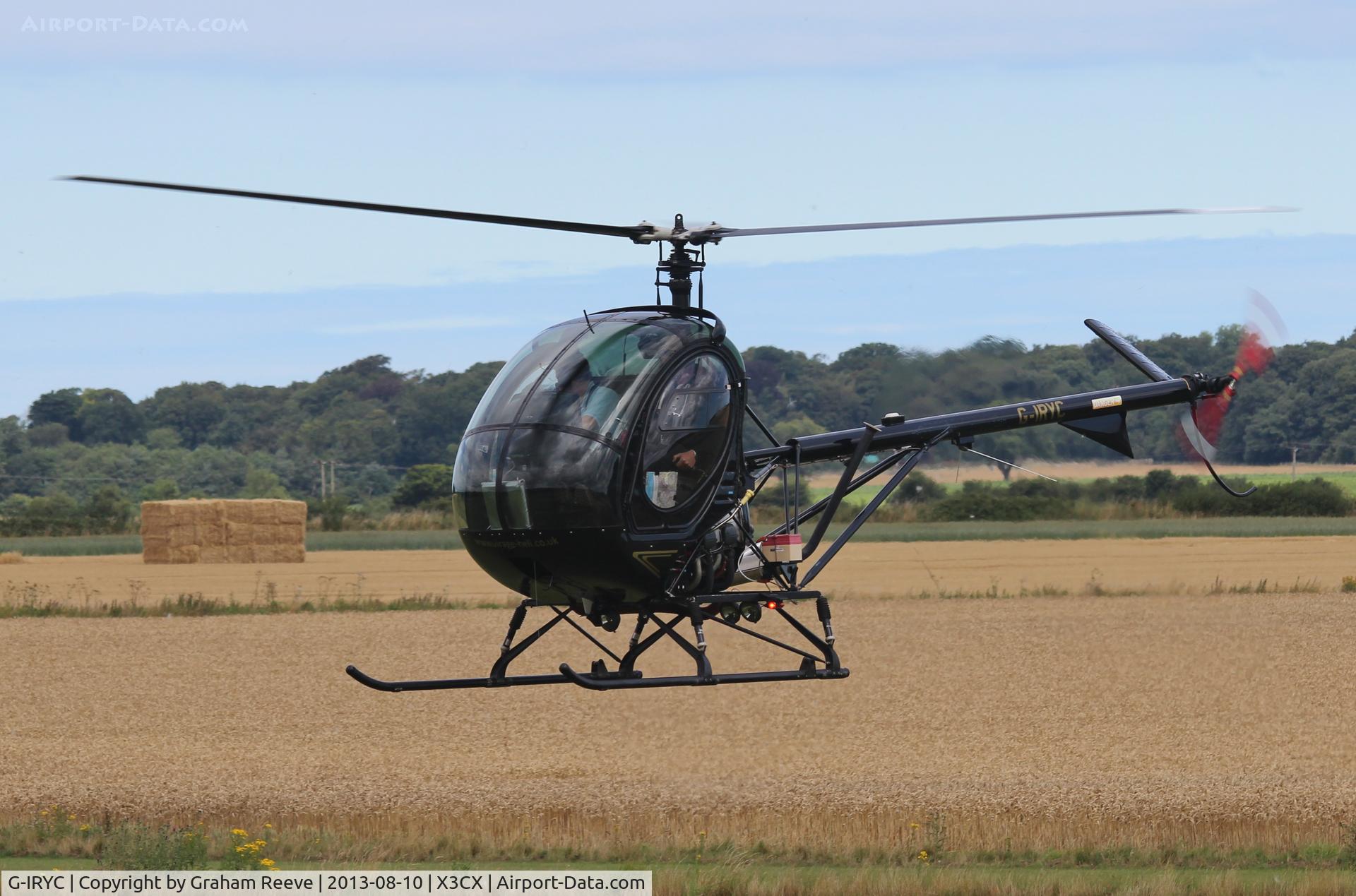 G-IRYC, 2004 Schweizer 269C-1 C/N 0194, About to land at Norhtrepps.