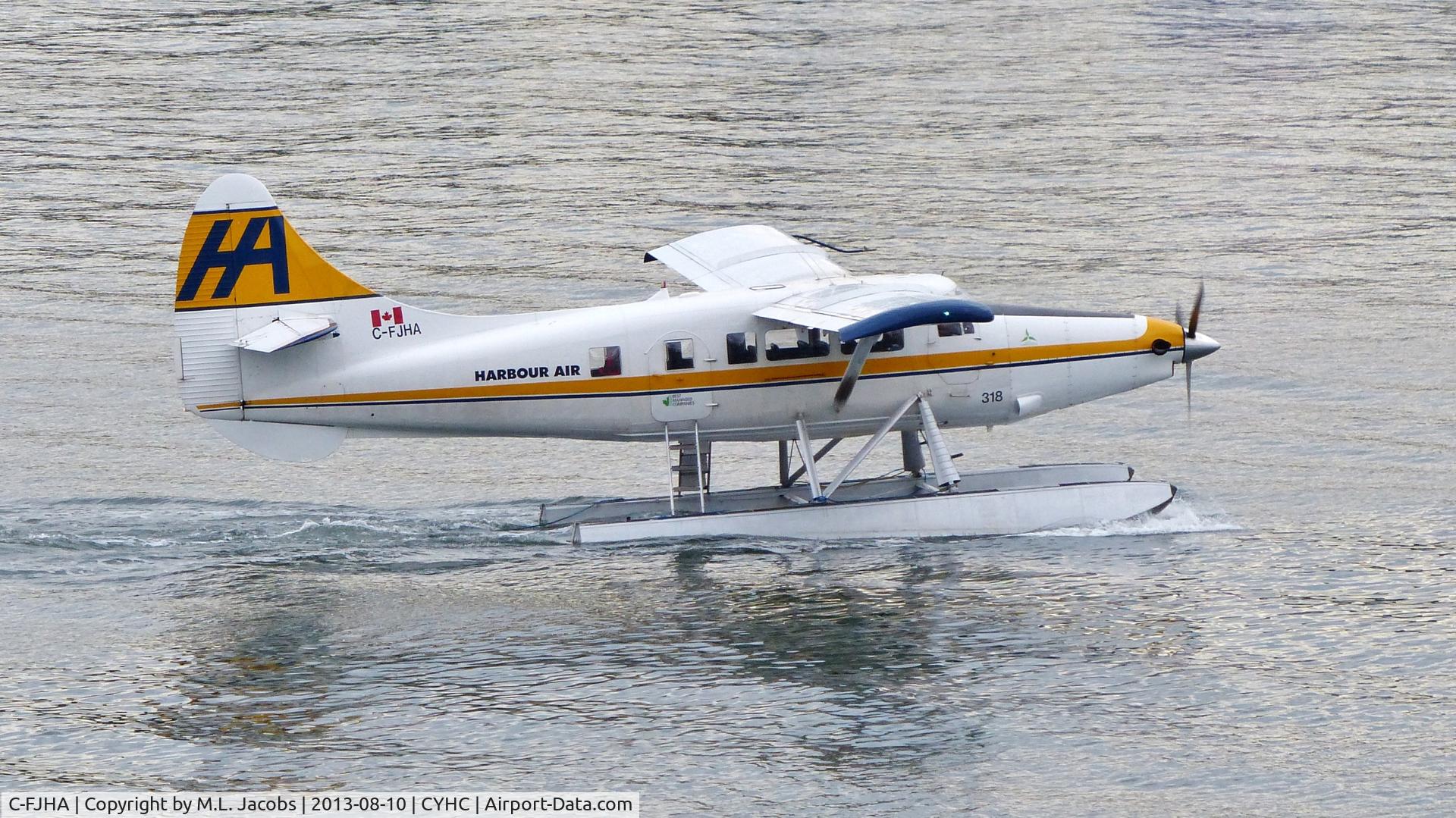 C-FJHA, 1960 De Havilland Canada DHC-3 Turbo Otter Otter C/N 393, Harbour Air #318 taxiing for departure from Coal Harbour.