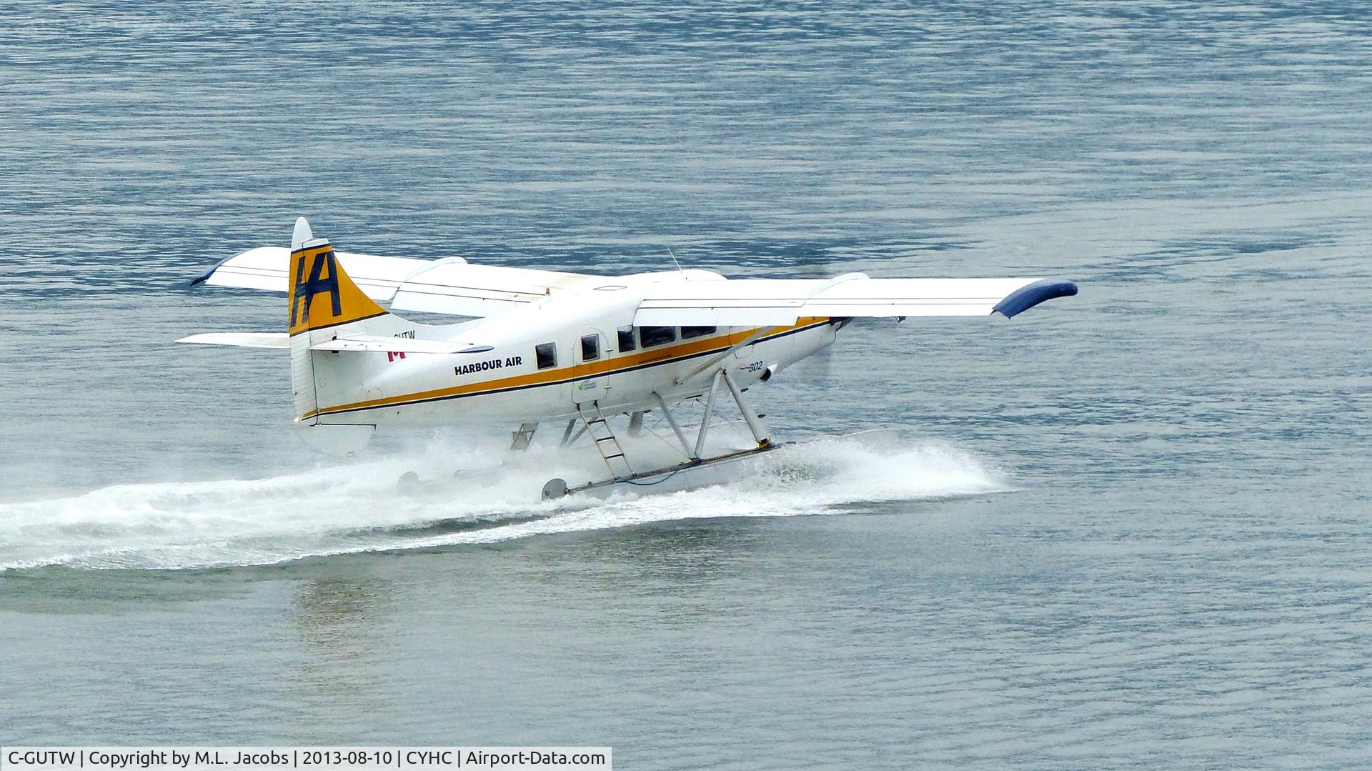 C-GUTW, 1960 De Havilland Canada DHC-3 Turbo Otter Otter C/N 405, Harbour Air #302 taking off in Coal Harbour on an overcast morning.