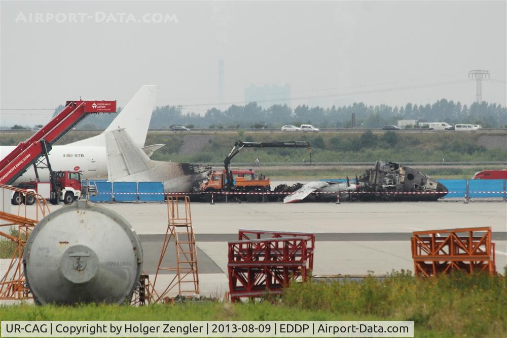 UR-CAG, 1969 Antonov An-12BK C/N 9346904, Death of an aircraft (and 49000 biddys) after burning up on apron 2 on early morning of 2012-08-09.