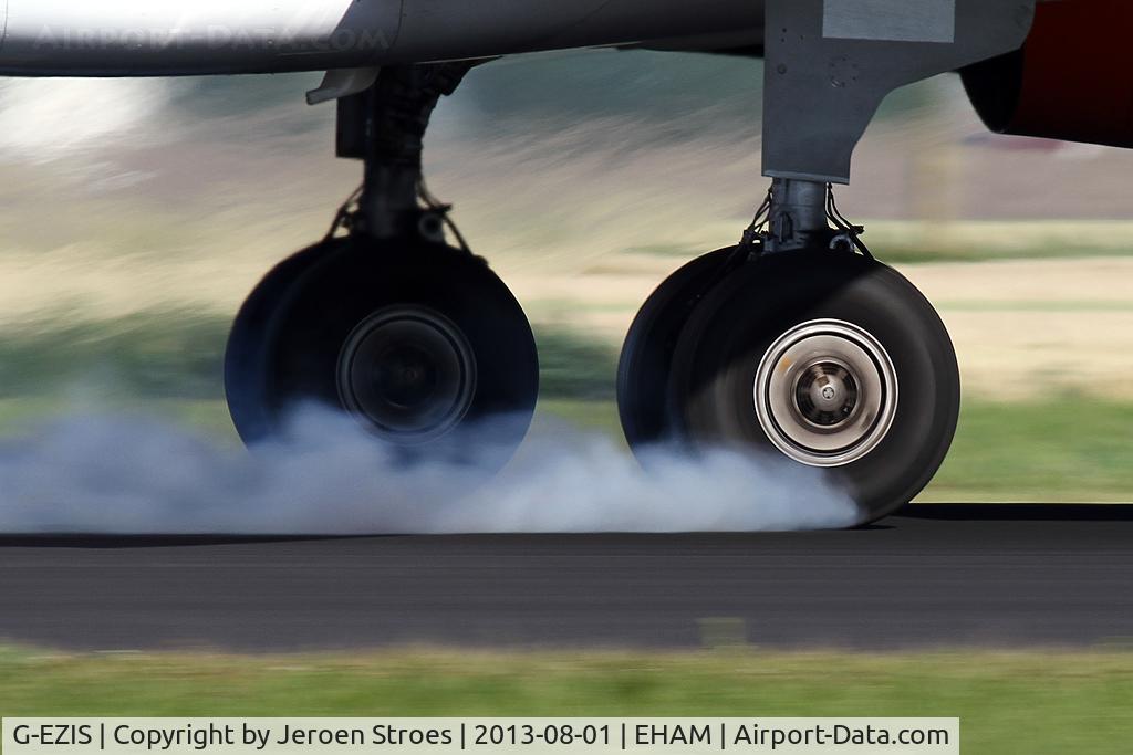 G-EZIS, 2005 Airbus A319-111 C/N 2528, smokey arrival