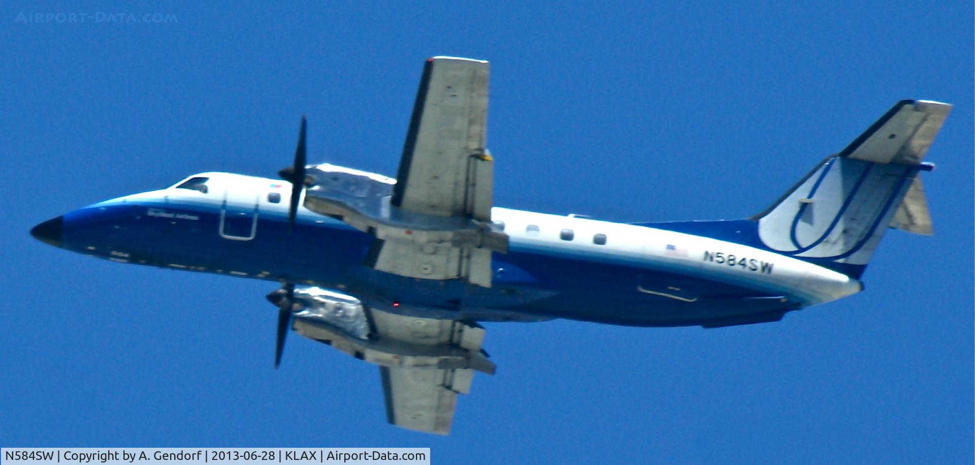 N584SW, 1999 Embraer EMB-120ER Brasilia C/N 120352, Sky West (United express cs.), is seen here departing from Los Angeles Int´l(KLAX)