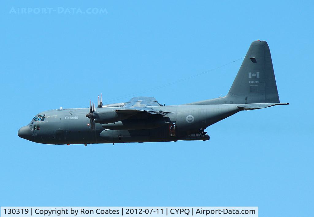 130319, 1965 Lockheed CC-130E Hercules C/N 382-4095, This 1970 C-130 Hercules of the Canadian Air Force over Peterborough Airport (CYPQ) during low level maneuvers. Notice airman on open ramp.