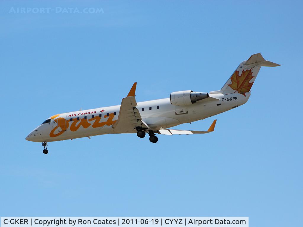 C-GKER, 2000 Bombardier CRJ-200ER (CL-600-2B19) C/N 7368, Landing on rwy 33L at Toronto Int'l Airport this Bombardier CL600 glides along in a cloudless sky