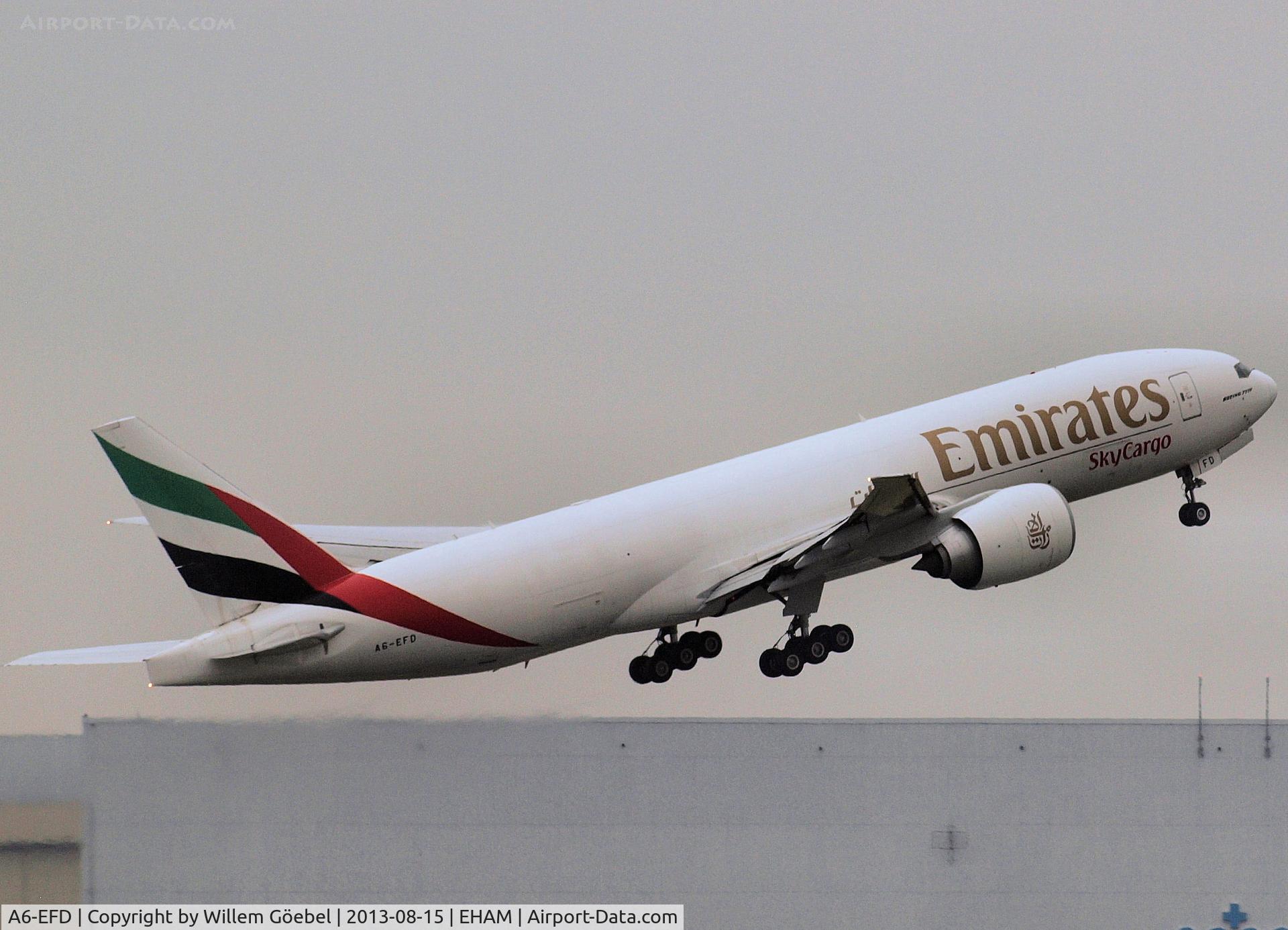 A6-EFD, 2009 Boeing 777-F1H C/N 35606, Take off from runway L18 of Schiphol Airport
