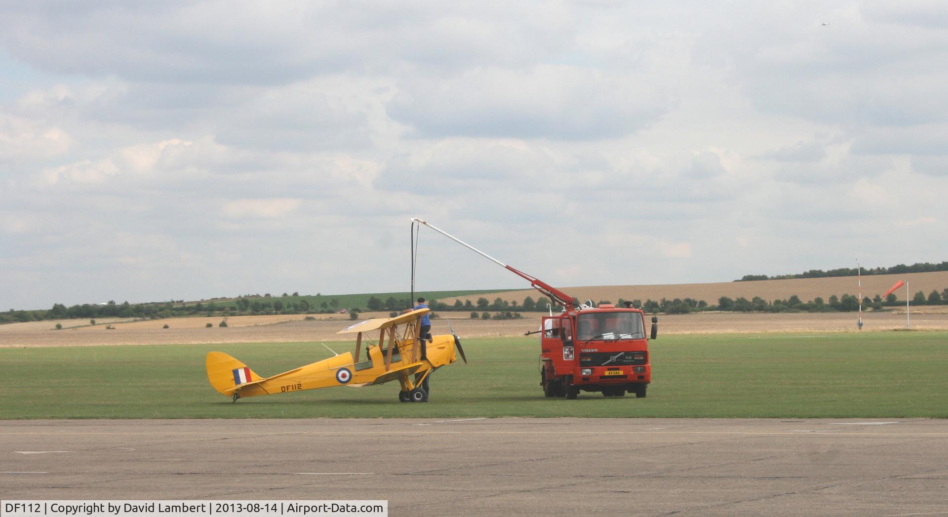 DF112, 1942 De Havilland DH-82A Tiger Moth II C/N 85861, Tiger Moth refueling at Duxford airfield