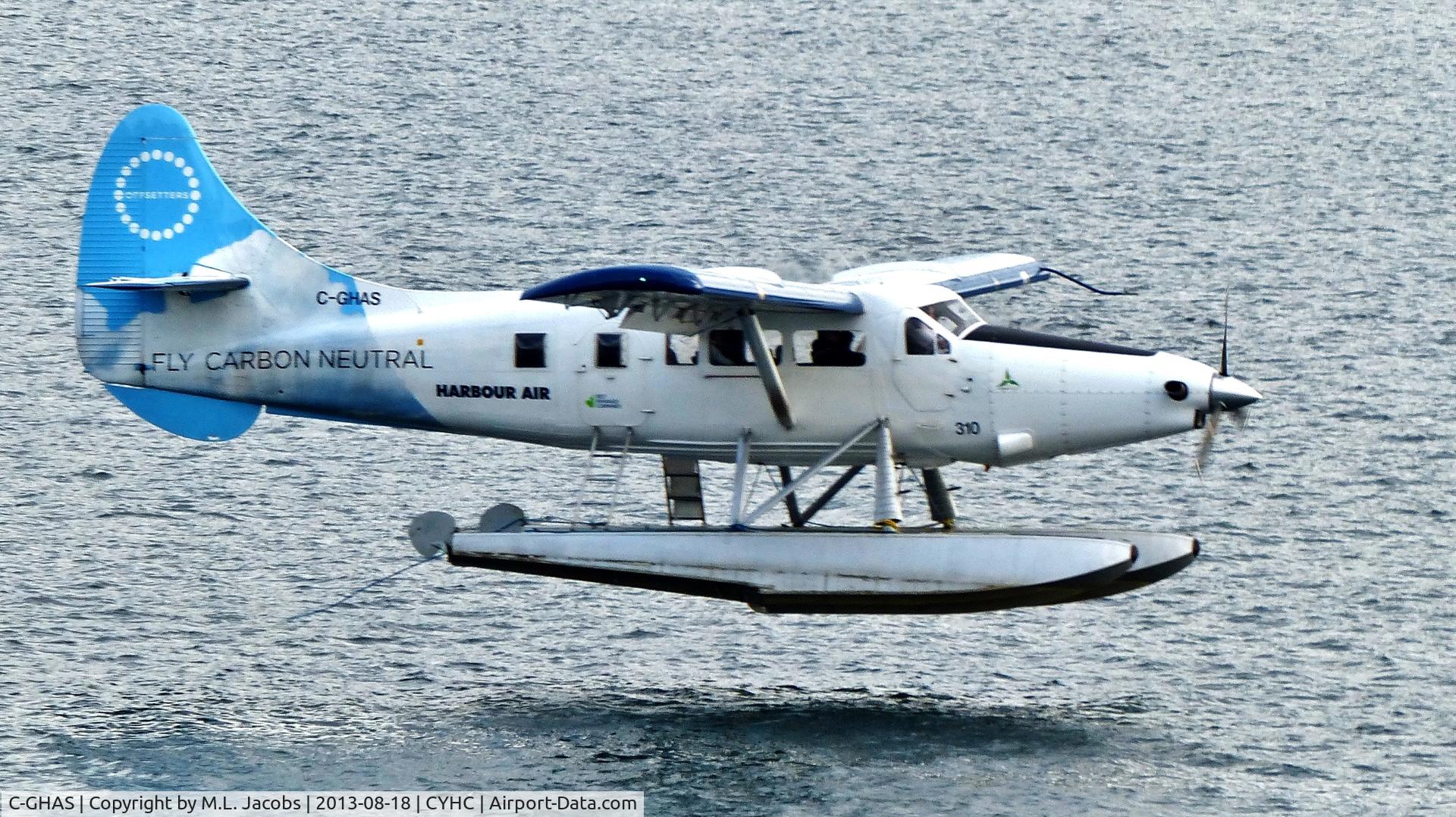 C-GHAS, 1958 De Havilland Canada DHC-3 Otter C/N 284, Harbour Air #310 about to touch down in Coal Harbour under overcast skies.