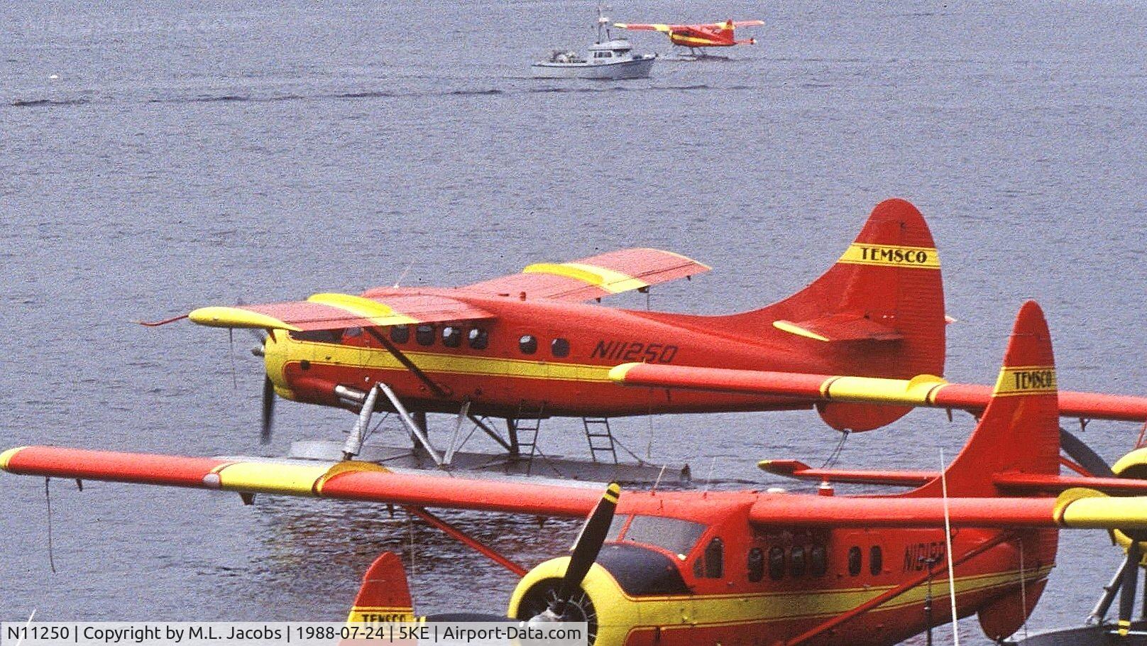 N11250, De Havilland Canada DHC-3 Otter Otter C/N 171, Temsco Air Otter taxiing out for takeoff in Ketchikan Harbor (Alaska) on a rainy day.