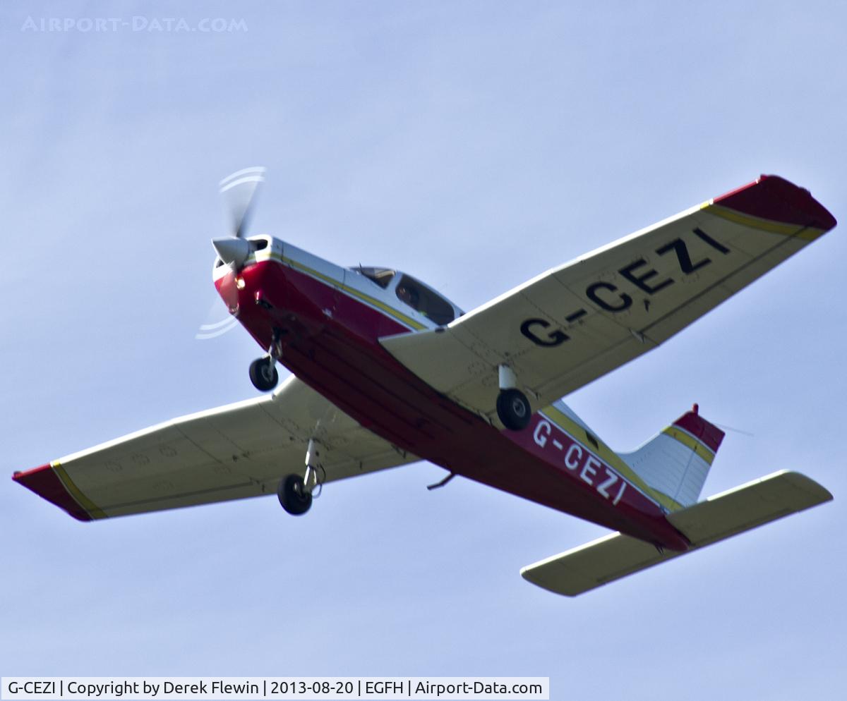 G-CEZI, 1989 Piper PA-28-161 Cadet C/N 2841228, Piper Cadet pulling out from runway 22 at EGFH en route to EGFF.