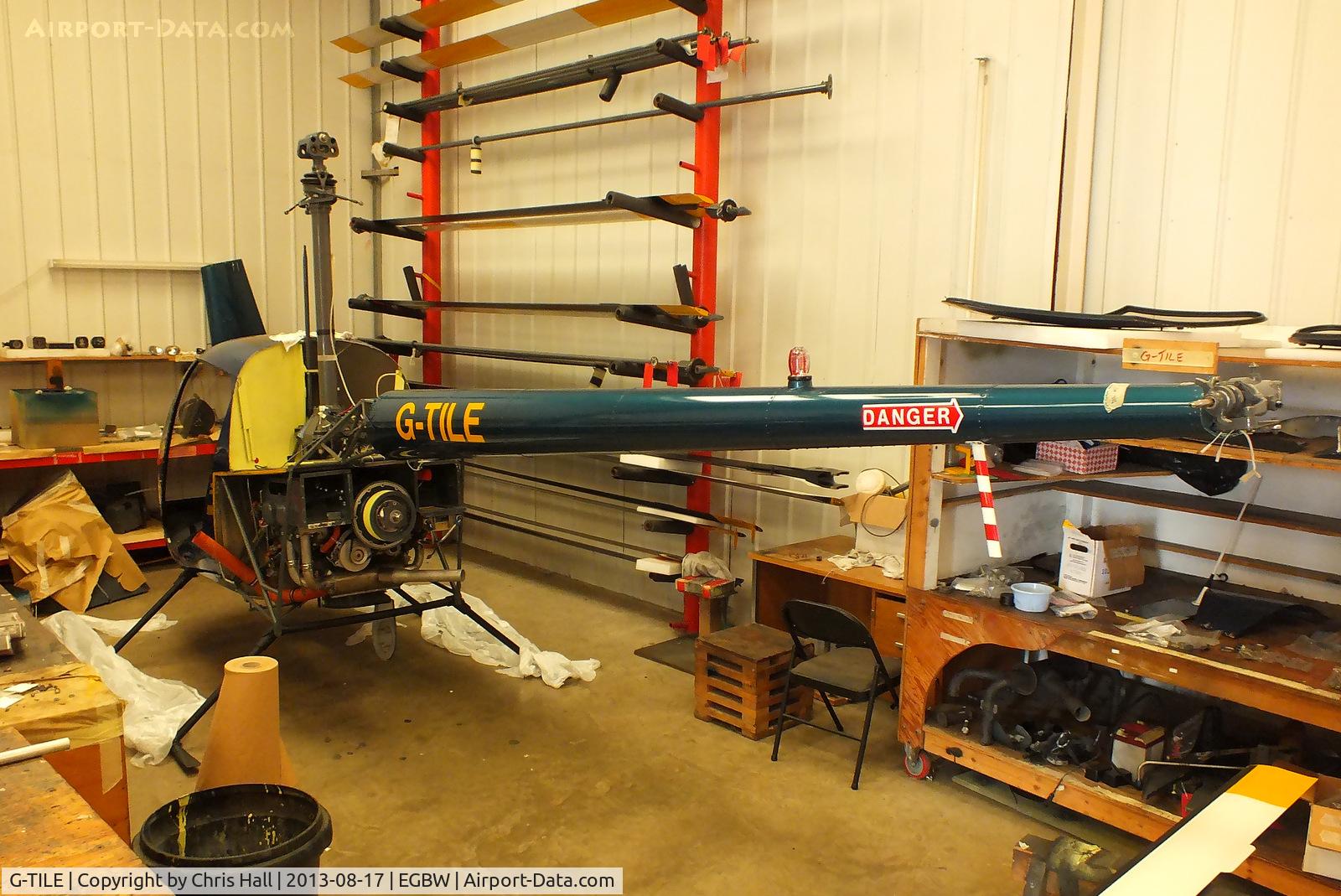 G-TILE, 1989 Robinson R22 Beta C/N 1100, slowly taking shape inside the Heliair hangar