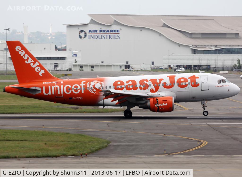 G-EZIO, 2005 Airbus A319-111 C/N 2512, Landing rwy 14R in UNICEF c/s