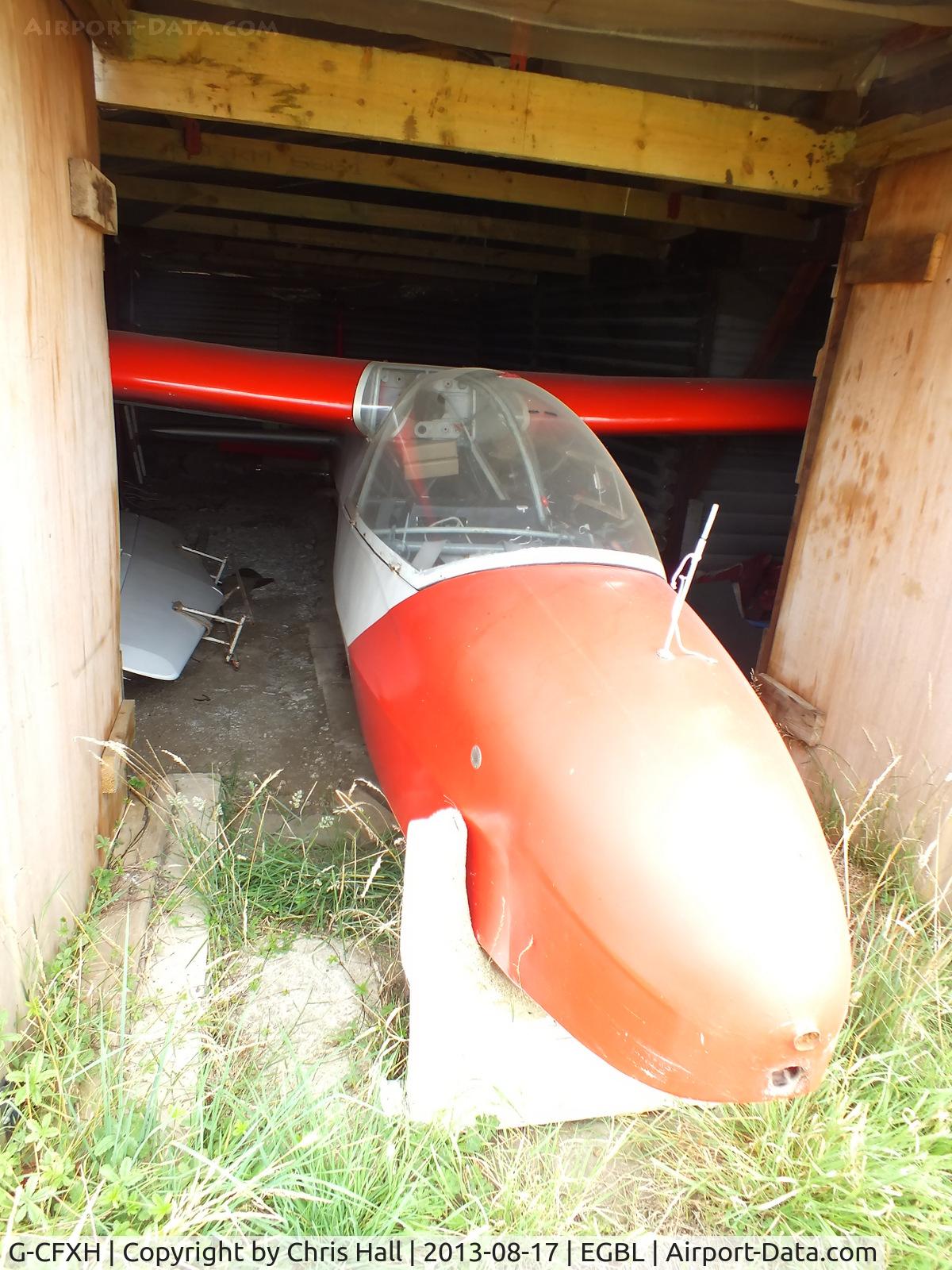 G-CFXH, 1958 Schleicher Ka-7 Rhonadler C/N 353, just its nose poking out of the hangar