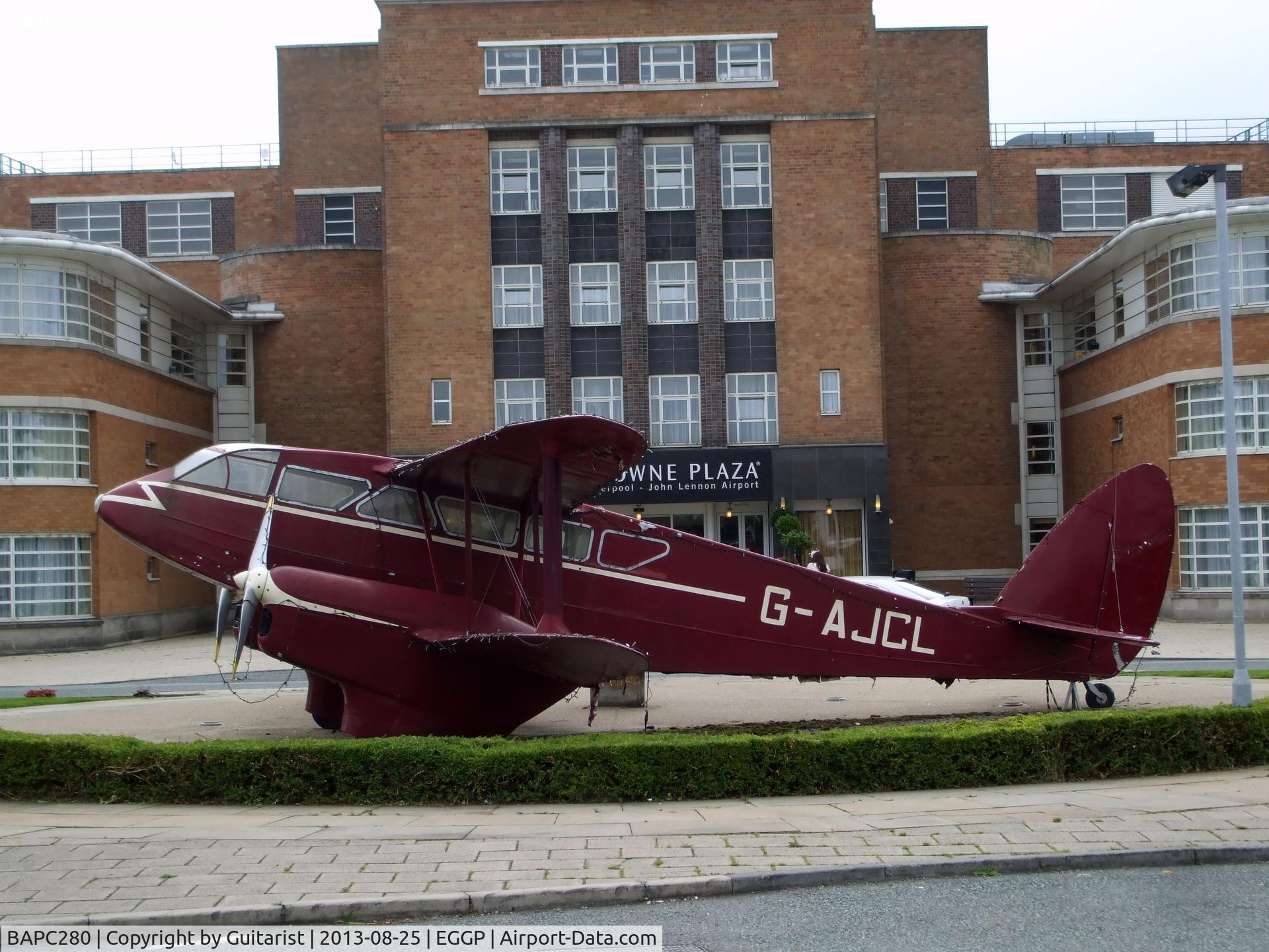 BAPC280, 1944 De Havilland DH-89A Rapide Replica C/N BAPC280, This replica Dragon Rapide is outside the entrance to the Crowne Plaza hotel situated in the old terminal building at Liverpool Airport.