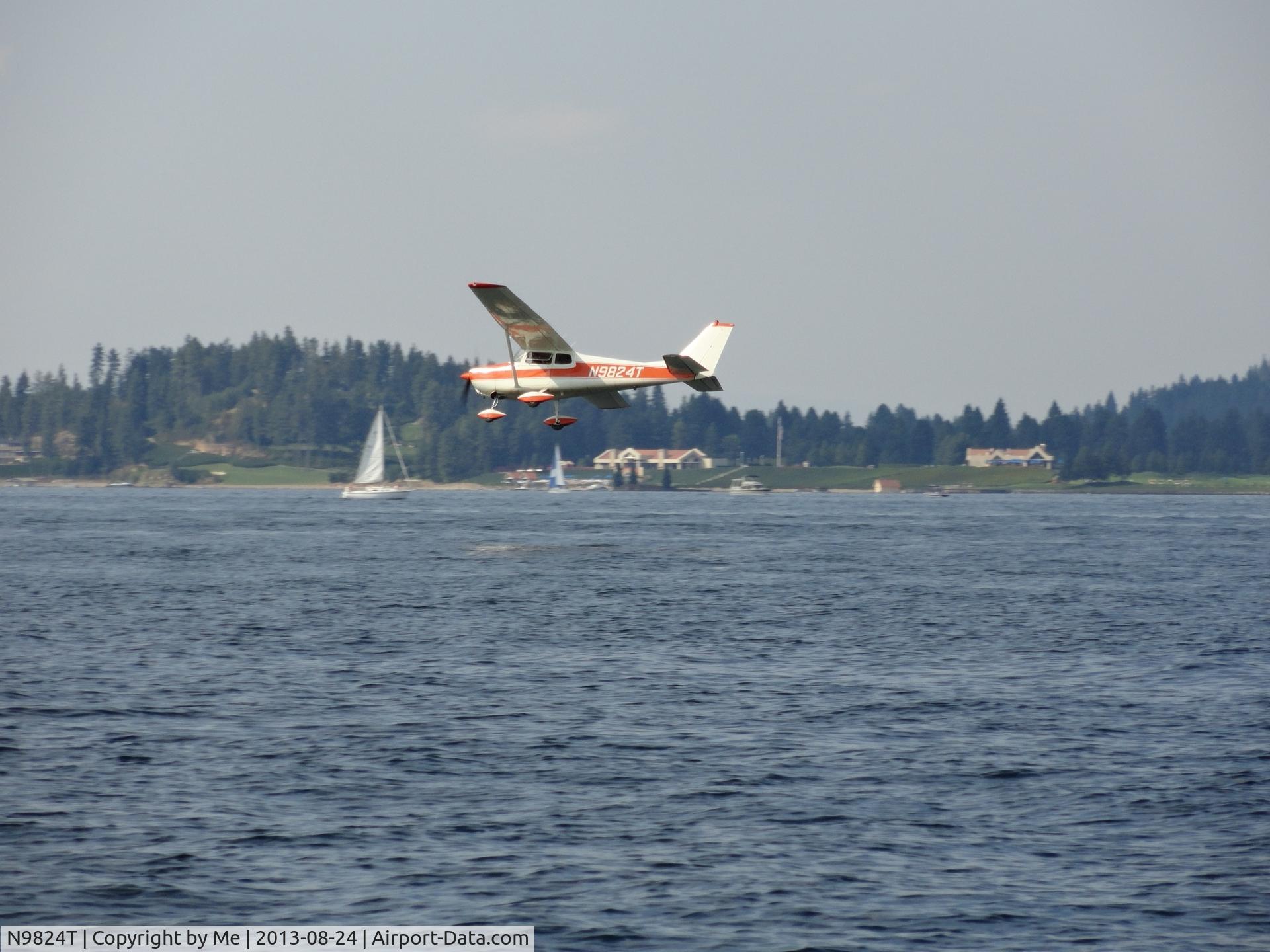 N9824T, 1960 Cessna 172A C/N 47624, Low flying over Lake Coeur d'Alene on Saturday, August 24, 2013 at 3PM.