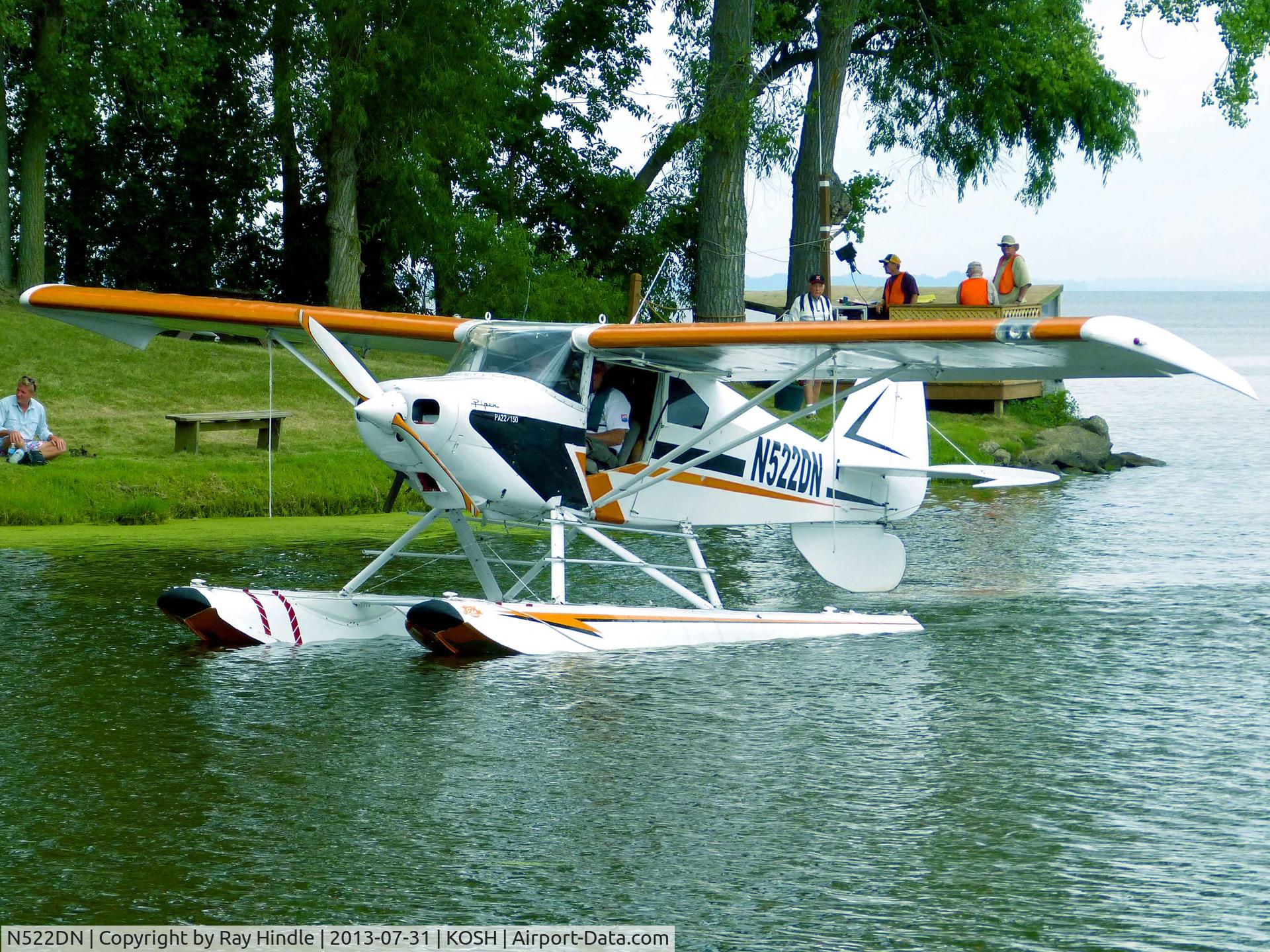 N522DN, 1959 Piper PA-22-150 C/N 226587, AirVenture 2013 Seaplane Base, engine cut and coasting to a perfect docking at the landing stage