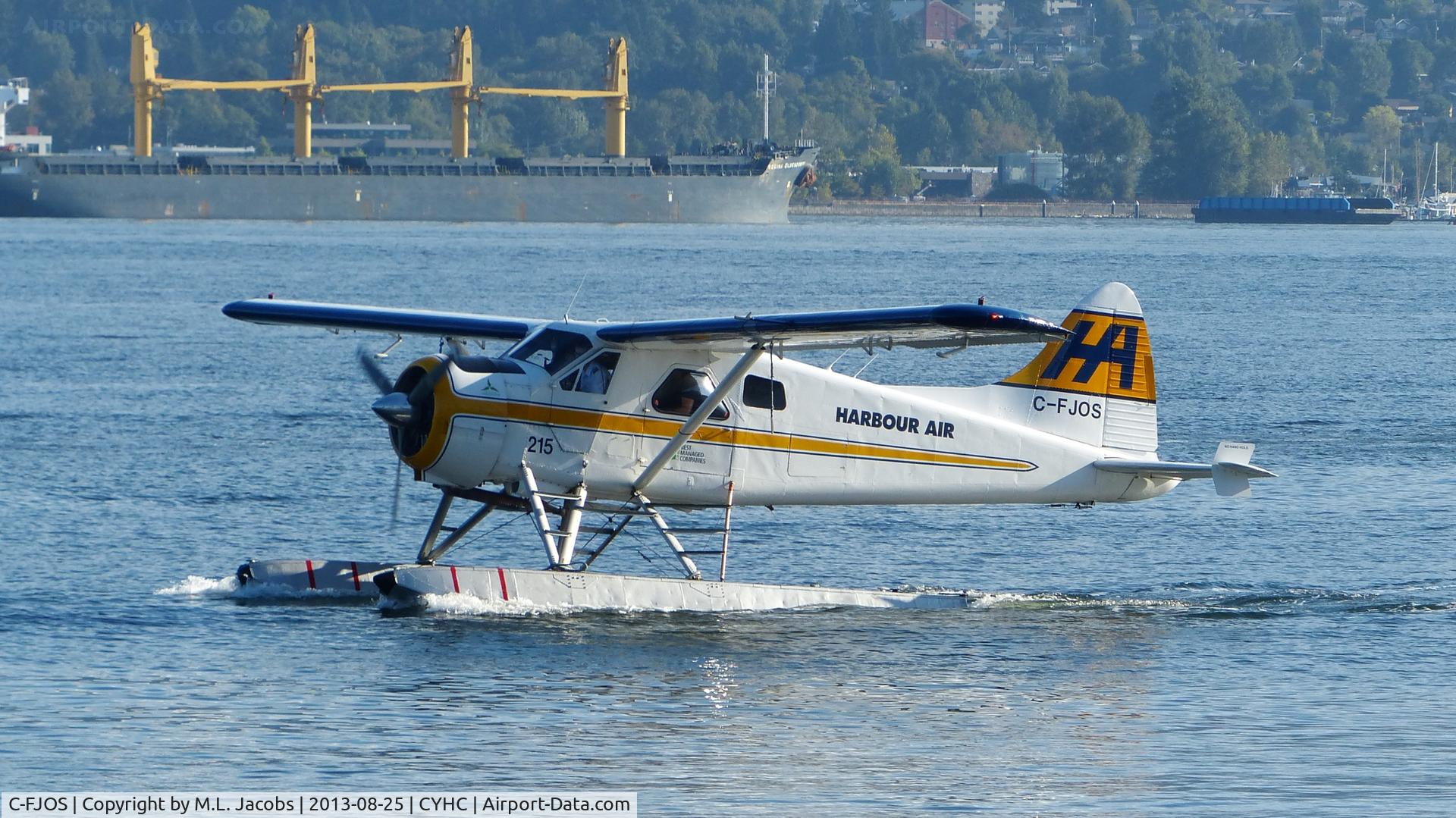 C-FJOS, 1956 De Havilland Canada DHC-2 Beaver Mk.1 C/N 1030, Harbour Air #215 taxiing to terminal in Coal Harbour.