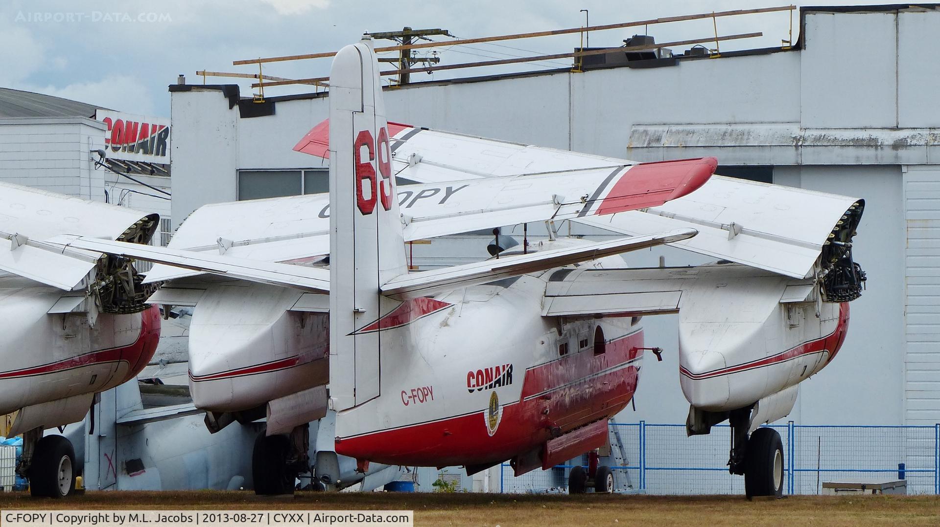 C-FOPY, 1957 Grumman (Conair) CS2F Firecat C/N 019, Conair #69 fire-fighting tanker is out of service but still registered and sits beside the Conair Aviation hangar.