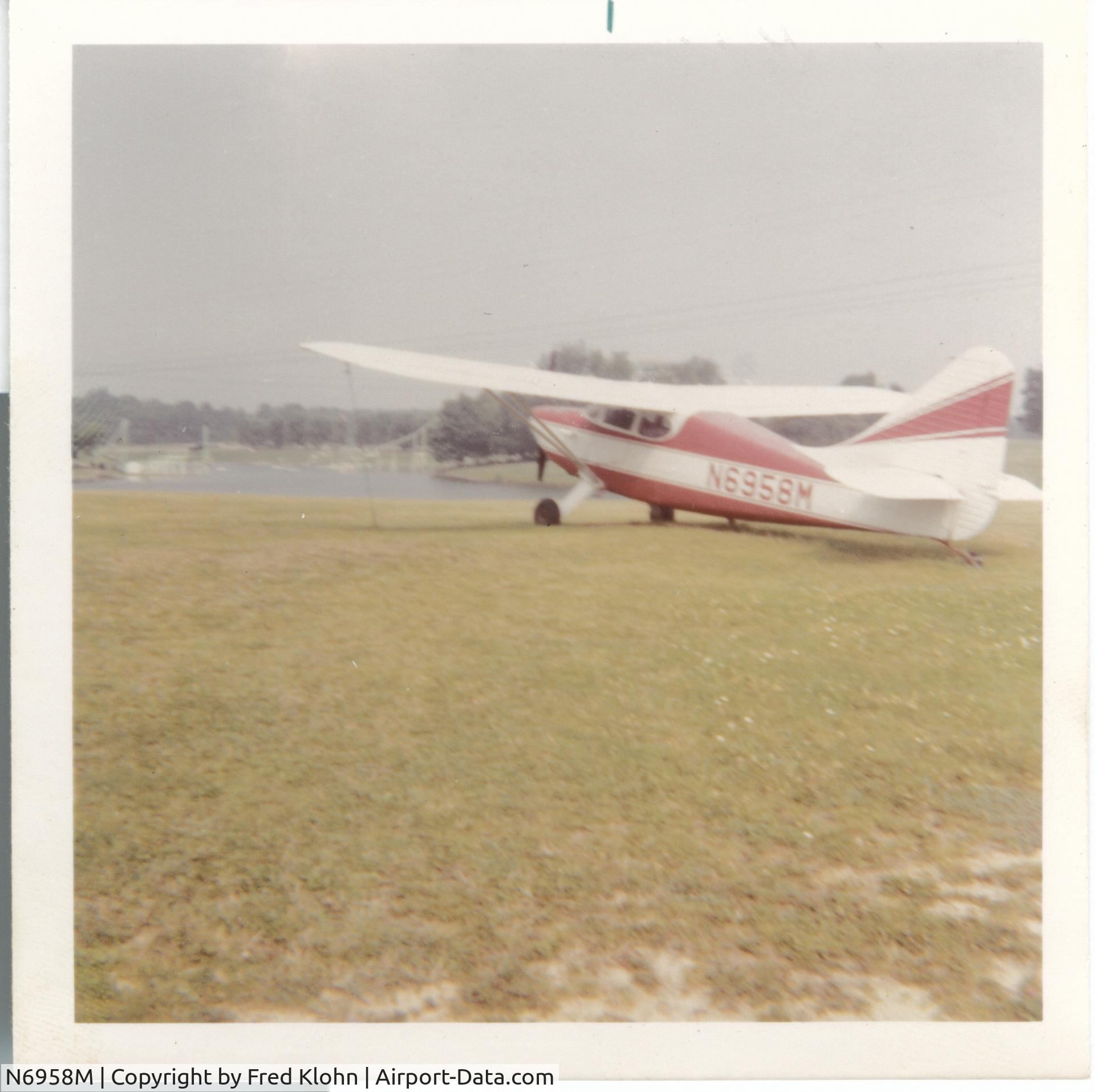 N6958M, 1948 Stinson 108-3 Voyager C/N 108-4958, circa 1970s Tied Down Near Holiday Sands Swimming Park