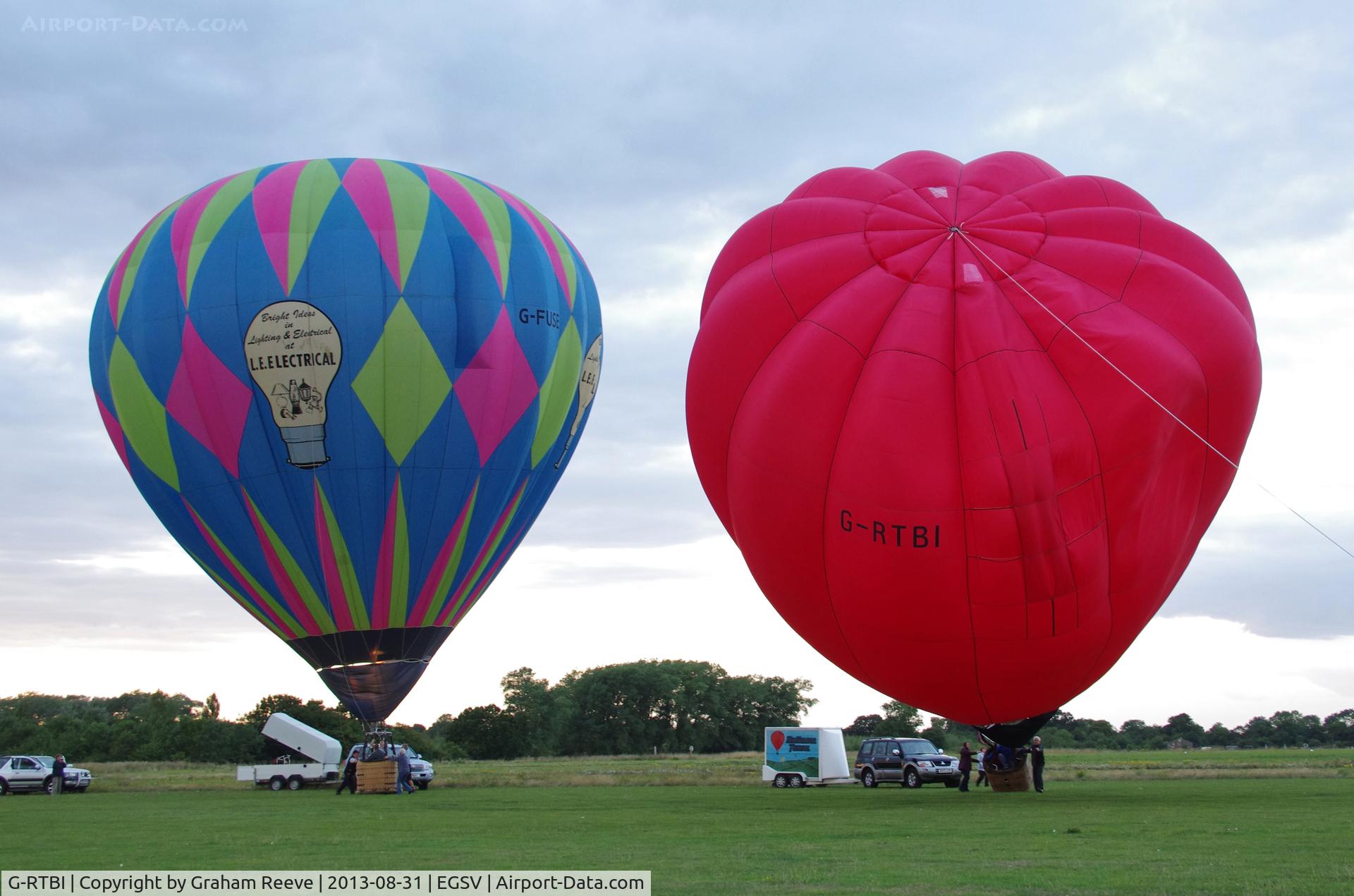 G-RTBI, 1994 Thunder & Colt Balloons AX6-56 C/N 2584, Being inflated with G-FUSE adjacent and to the rear.