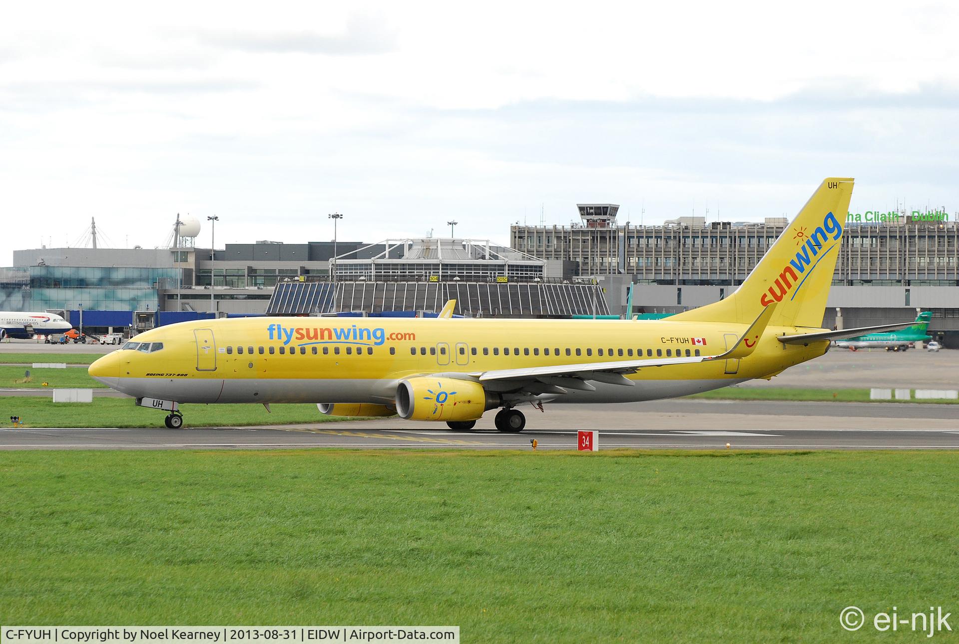C-FYUH, 2006 Boeing 737-8K5 C/N 34689, On lease to Thomson for holiday charters and seen about to depart off Rwy28 at Dublin.