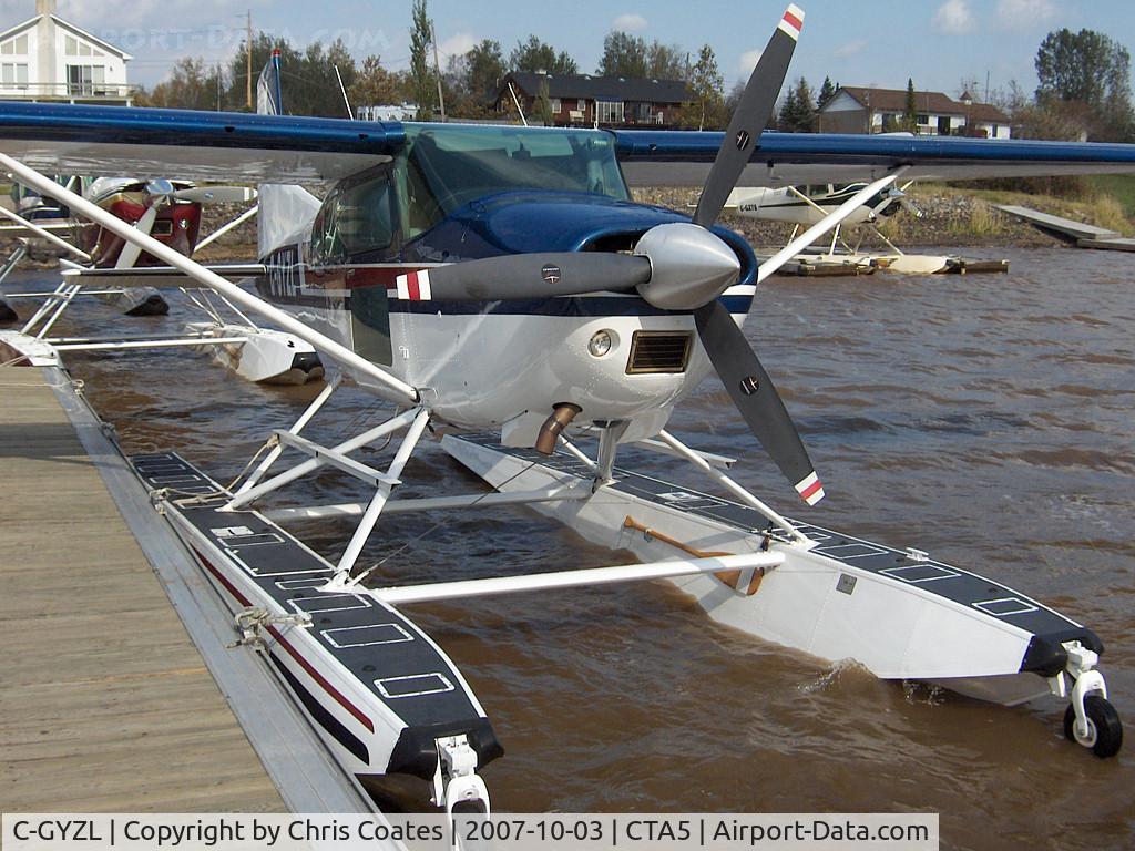 C-GYZL, 1977 Cessna A185F Skywagon 185 C/N 185-03373, Strong winds made this Skywagon sound like it wanted to break free from its dock on Lac Lemoine at the Hydrobase Piche Dubuisson Seaplane near Val-d'Or, Quebec. I liked its see-through doors & the Viking emblem on its tail.