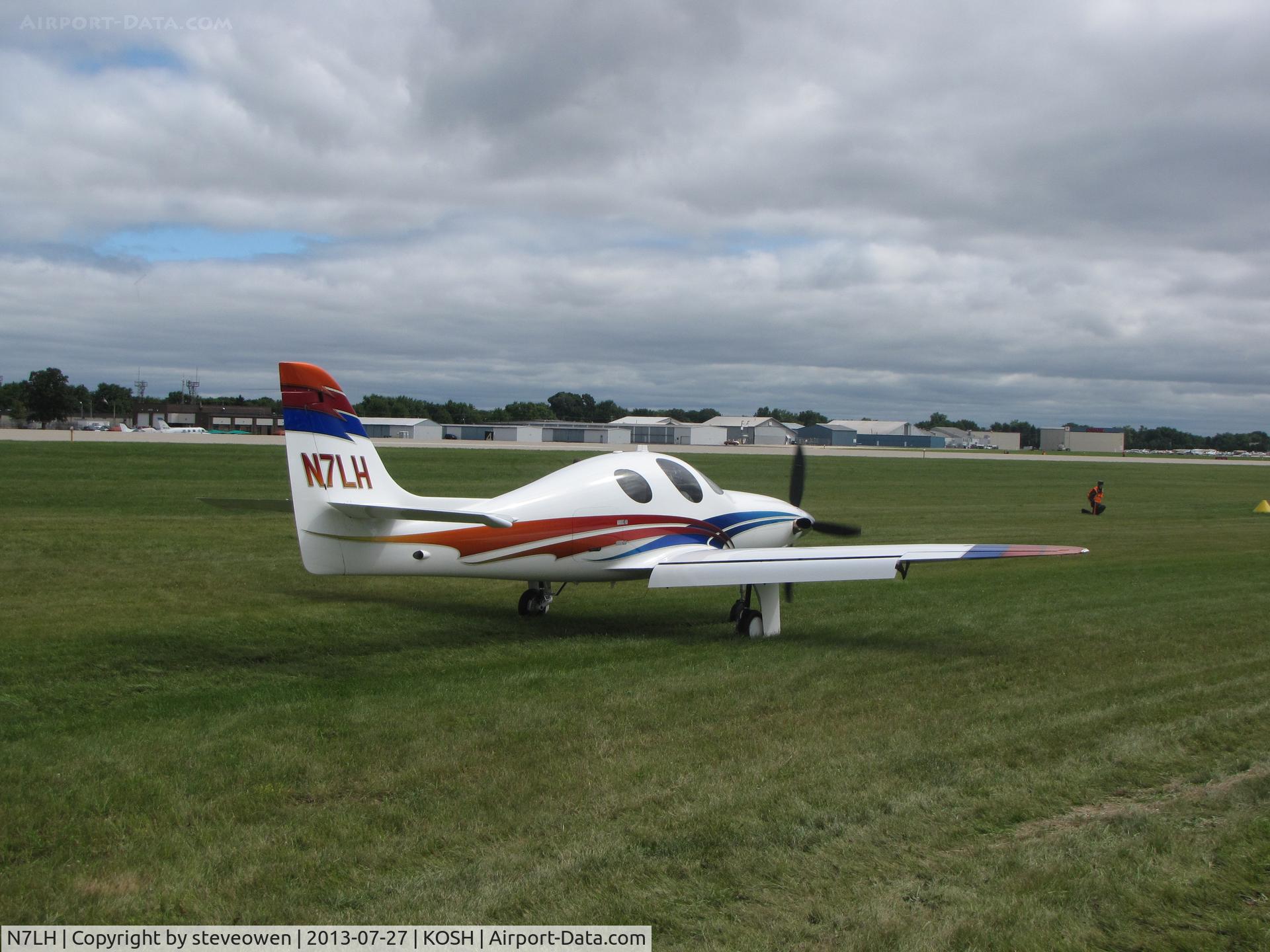 N7LH, Lancair Evolution C/N EVO-015, Taxing  in the grass at Oshkosh