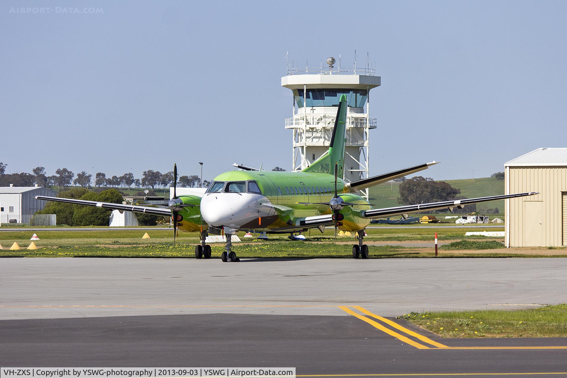 VH-ZXS, 1990 Saab 340B C/N 340B-179, Pel-Air Saab 340B (VH-ZXS) in former Happy Air Travellers livery parked on the tarmac at Wagga Wagga Airport.