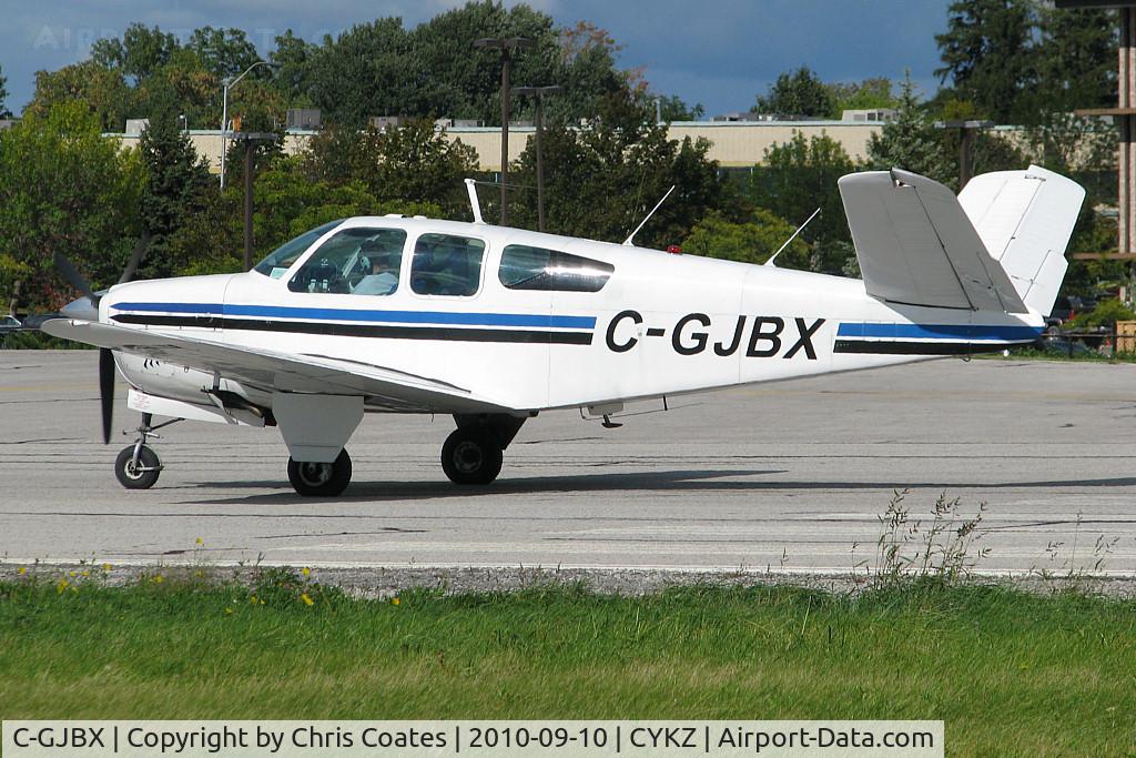 C-GJBX, 1957 Beech J35 Bonanza C/N D-5360, Lined up & ready to roll on runway 33 was this nice Bonanza with its neat looking Butterfly Tail. It was built in 1958 & lives in Toronto. I think people who are not even interested in aircraft still reconize this type.