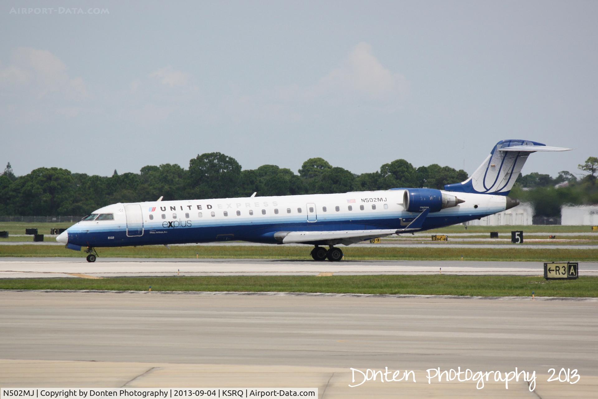 N502MJ, 2002 Bombardier CRJ-700 (CL-600-2C10) Regional Jet C/N 10050, United Flight 3751 operated by Mesa (N502MJ) arrives at Sarasota-Bradenton International Airport following a flight from Chicago-O'Hare International Airport