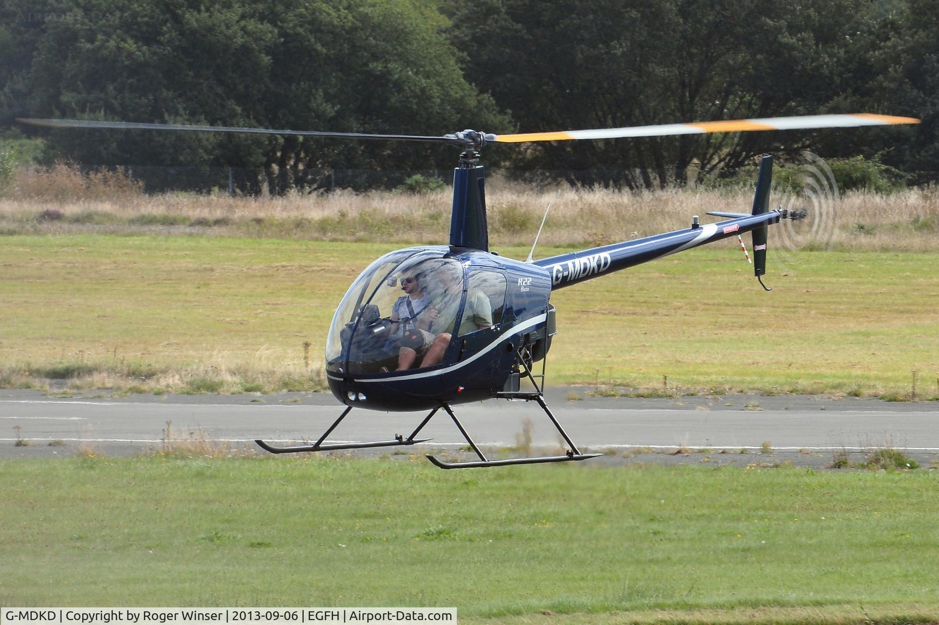 G-MDKD, 1990 Robinson R22 Beta C/N 1247, Recent resident. Heli-air Wales's R-22 helicopter in a new dark blue colour scheme.