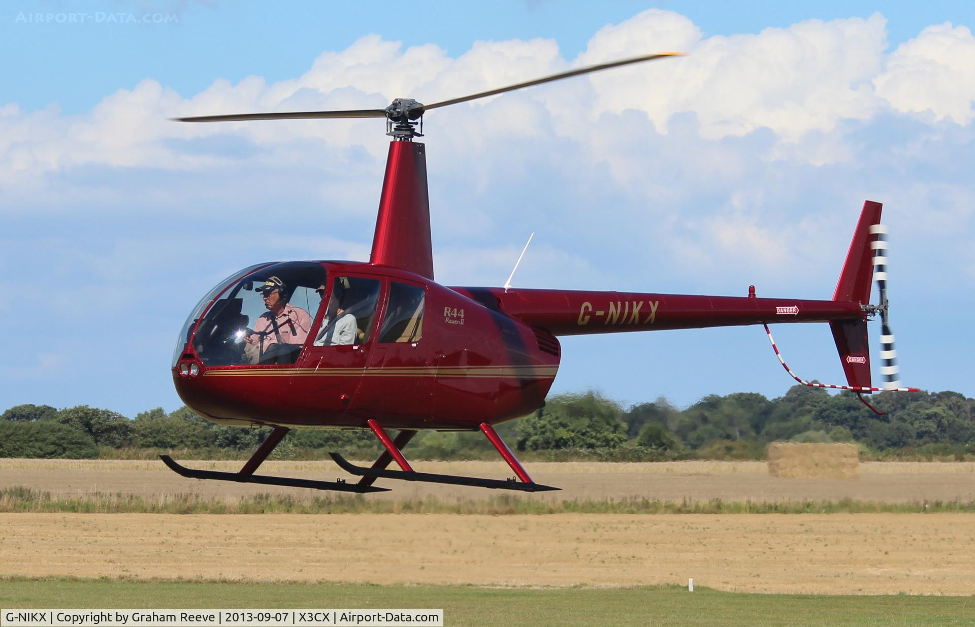 G-NIKX, 2008 Robinson R44 Raven II C/N 12306, About to land at Northrepps.