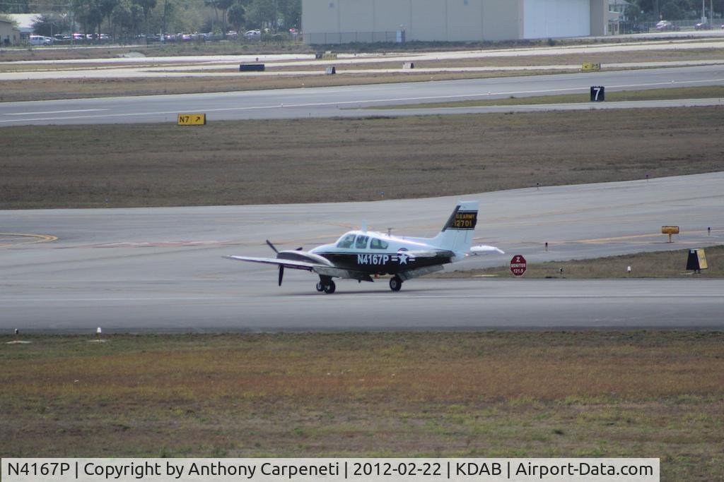 N4167P, 1965 Beech B-55 Baron (T-42A) C/N TF-23, This little guy came as a complete surprise. Dont know what it was doing in Daytona but it came in at the same time a C17 from the Stewart ANG base came to drop off support for the Thunderbirds.