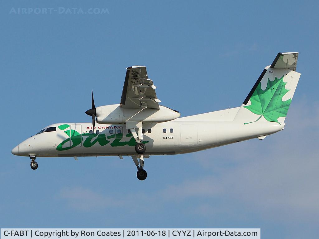 C-FABT, 1986 De Havilland Canada DHC-8-102 Dash 8 C/N 049, Dash 8 landing on rwy 33L at Toronto Int'l Airport (YYZ)