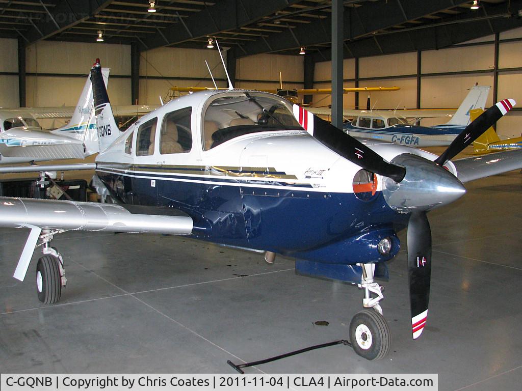 C-GQNB, 1977 Piper PA-28R-201T Cherokee Arrow III C/N 28R-7703248, This sharp looking Arrow was resting inside its home base hangar here at Holland Landing Airpark.