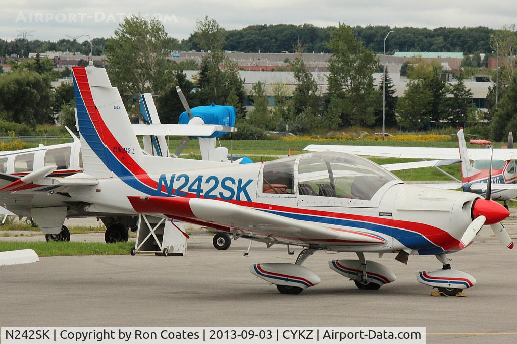 N242SK, 1994 Moravan Z242L C/N 0663, 1994 Moravan with its sleek paint scheme sits on the ramp at Buttonville Municipal Airport. CYKZ