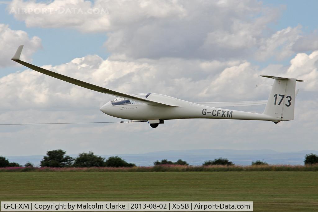 G-CFXM, 1983 Schempp-Hirth Discus bT C/N 16, Schempp-Hirth Discus BT being launched for a cross country flight during The Northern Regional Gliding Competition, Sutton Bank, North Yorks, August 2nd 2013.