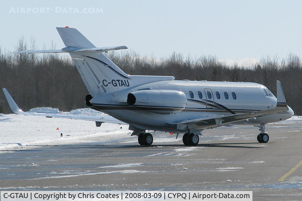 C-GTAU, 1989 British Aerospace BAe.125 Series 800A C/N 258173, This nice Hawker bizjet was running its engines for the first time since being refurbished here at Peterborough Airport. Then it took off to the west.