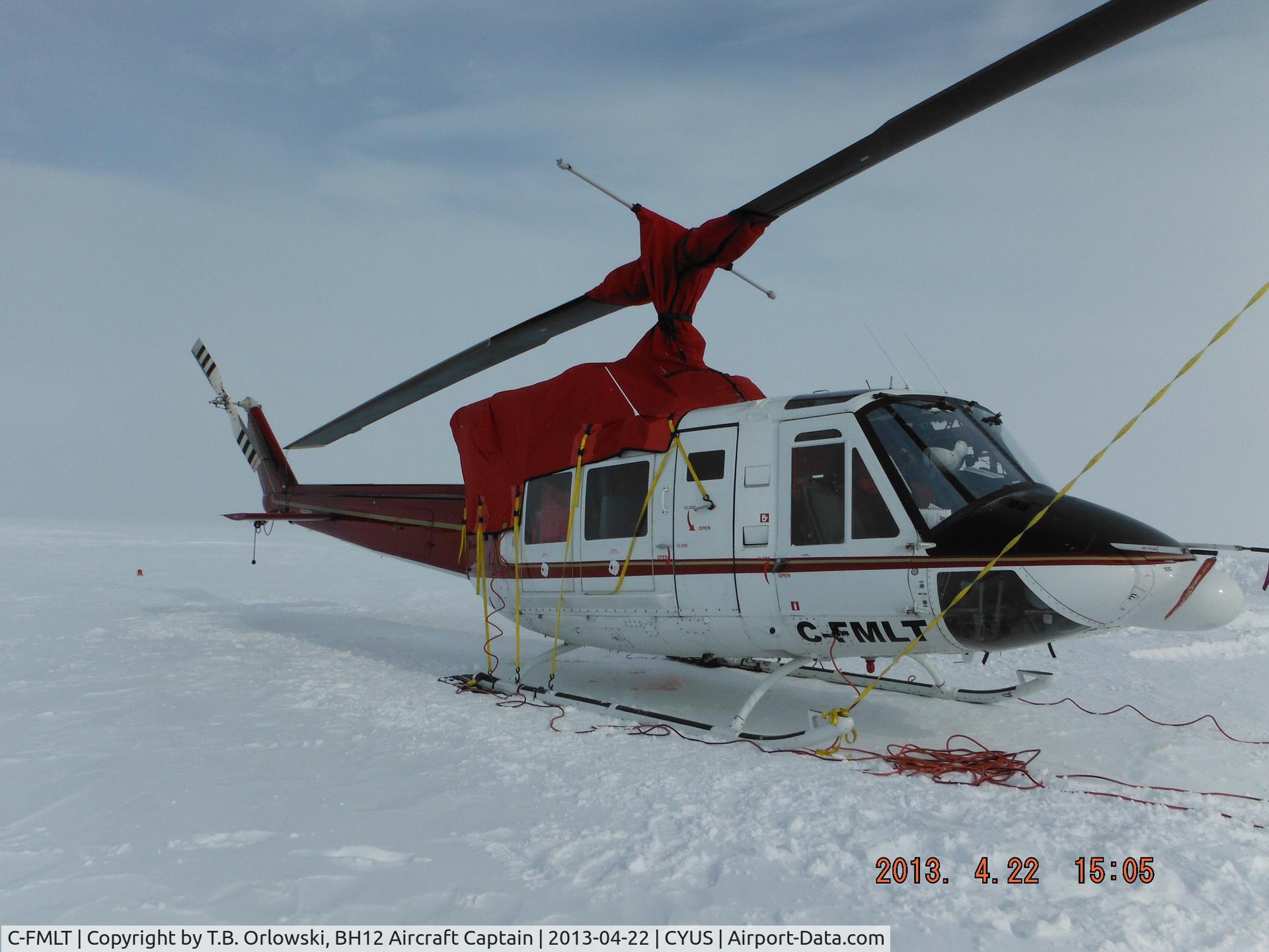 C-FMLT, 1978 Bell 212 C/N 30889, C-FMLT in Sheperd Bay (CYUS), Nunavut Canada, April 2013.  Note the cold-weather tarp (company based in Goose Bay), electrical plugs for Tannis Heater, and automotive space heaters. Flying operations cease when ambient air temperature reaches -40C / -40F.