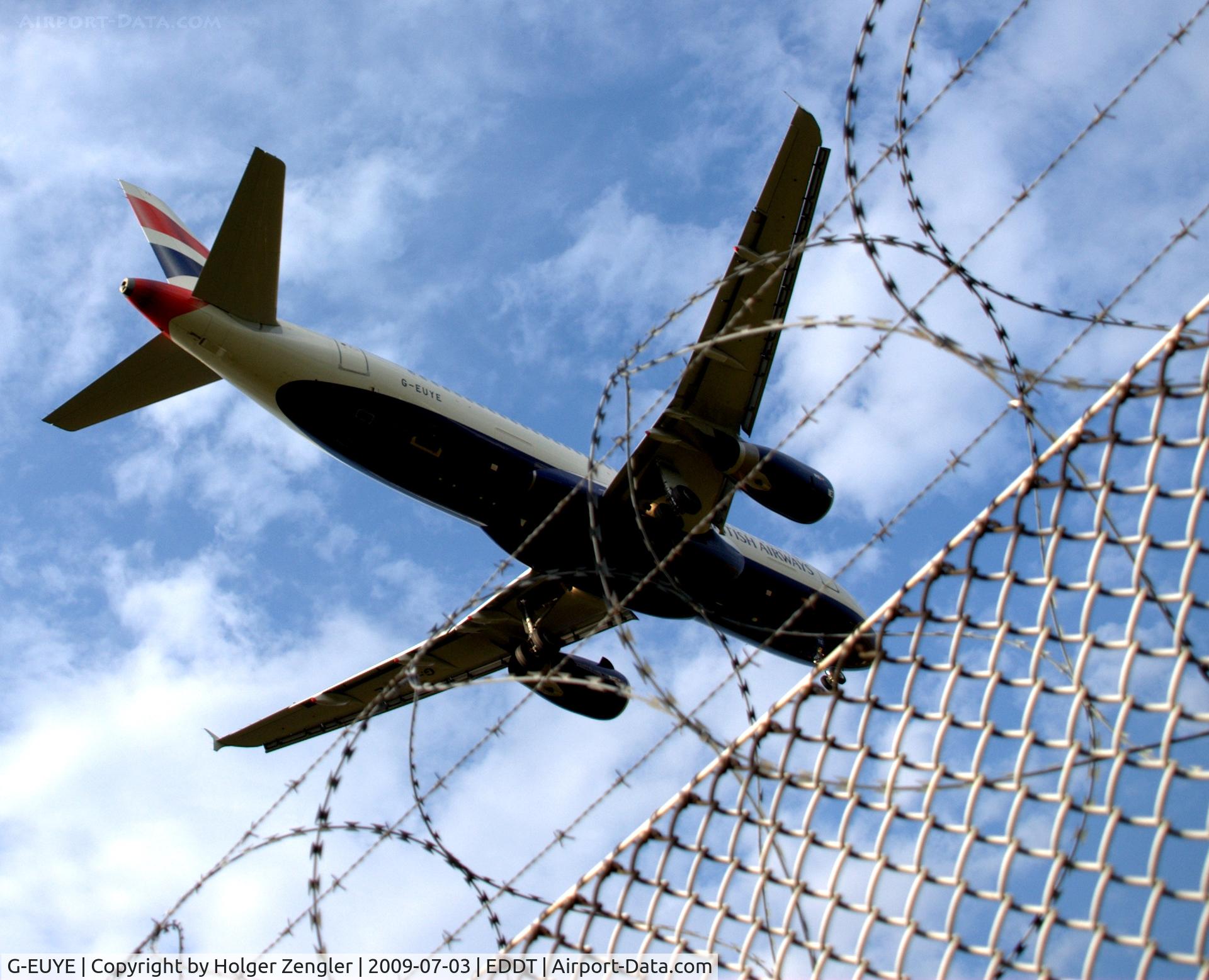 G-EUYE, 2009 Airbus A320-232 C/N 3912, Jumping over the western fence of TXL to runway 08 L