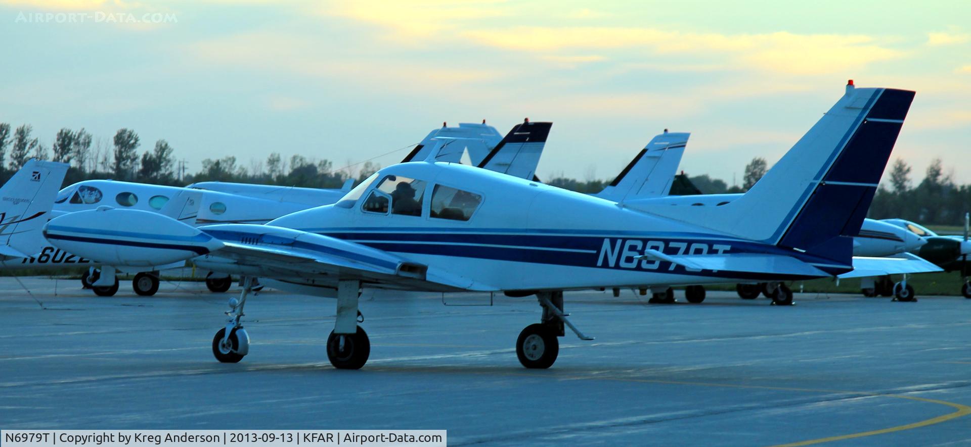 N6979T, 1960 Cessna 310D C/N 39279, Cessna 310D leaving the ramp at Fargo Jet Center to the active runway,