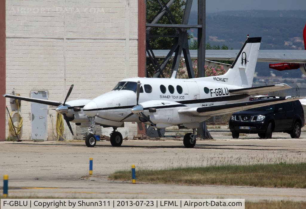 F-GBLU, 1979 Beech C90 King Air C/N LJ-822, Parked at Boussiron area with additional 'AOKIJET / Summer Tour 2013' titles