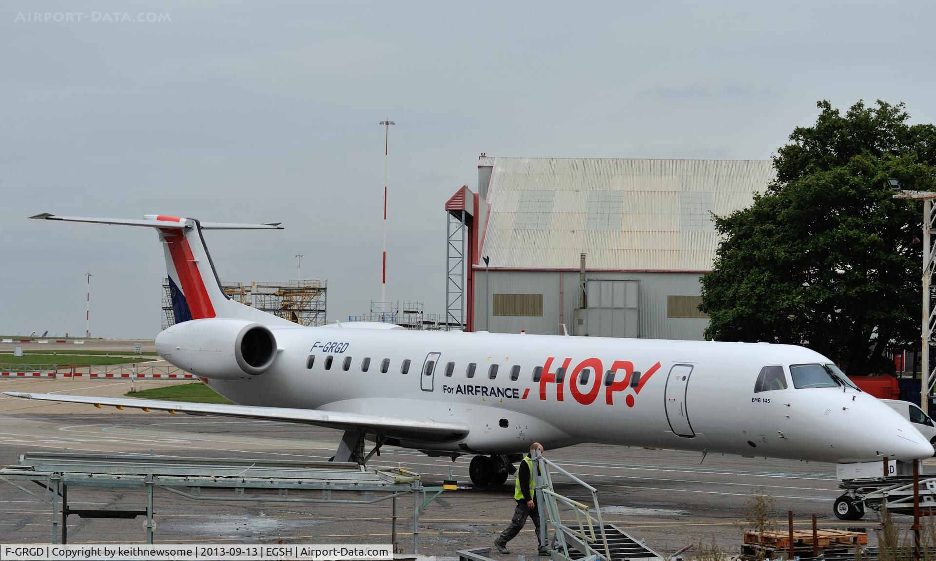 F-GRGD, 1998 Embraer EMB-145EU (ERJ-145EU) C/N 145043, Amongst the clutter of a spray roll out !