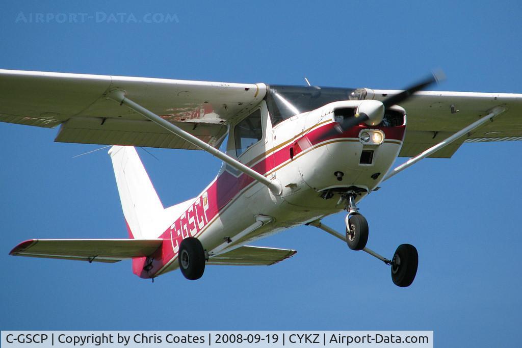 C-GSCP, 1977 Cessna 150M C/N 15079191, This little Cessna was about to land on runway 15 after returning from a training flight. It lives here & is a busy plane that's always flying with student pilots at the controls.