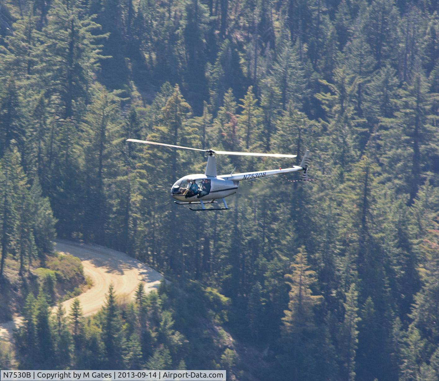 N7530B, 2004 Robinson R44 II C/N 10390, Robinson R44 flying below in the Tahoe NF, Sierra Nevadas.