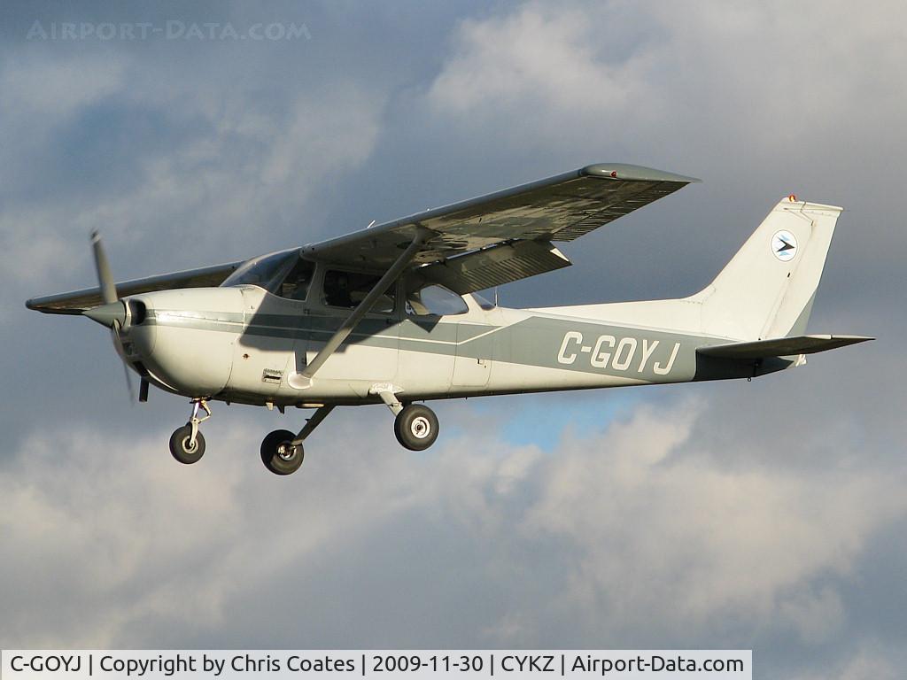 C-GOYJ, 1974 Cessna 172M C/N 17263968, As torn & frayed clouds swirled above this nice Skyhawk was about to land on 33. I've always liked the colour of this busy plane that's owned by the Toronto Airways flying club.