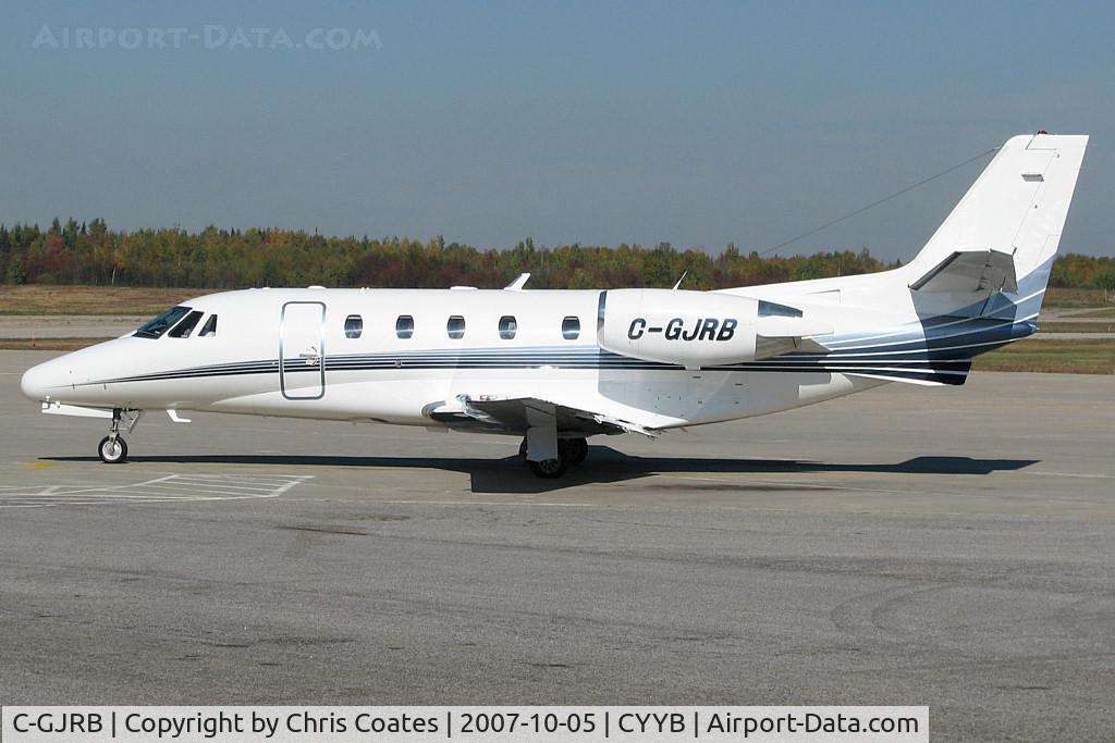 C-GJRB, 1999 Cessna 560 XL Citation Excel C/N 560-5026, A stretch limo just dropped off passengers for this nice metalic blue Citation. Then its engines started & it began taxiing here at North Bay's Jack Garland Airport. 