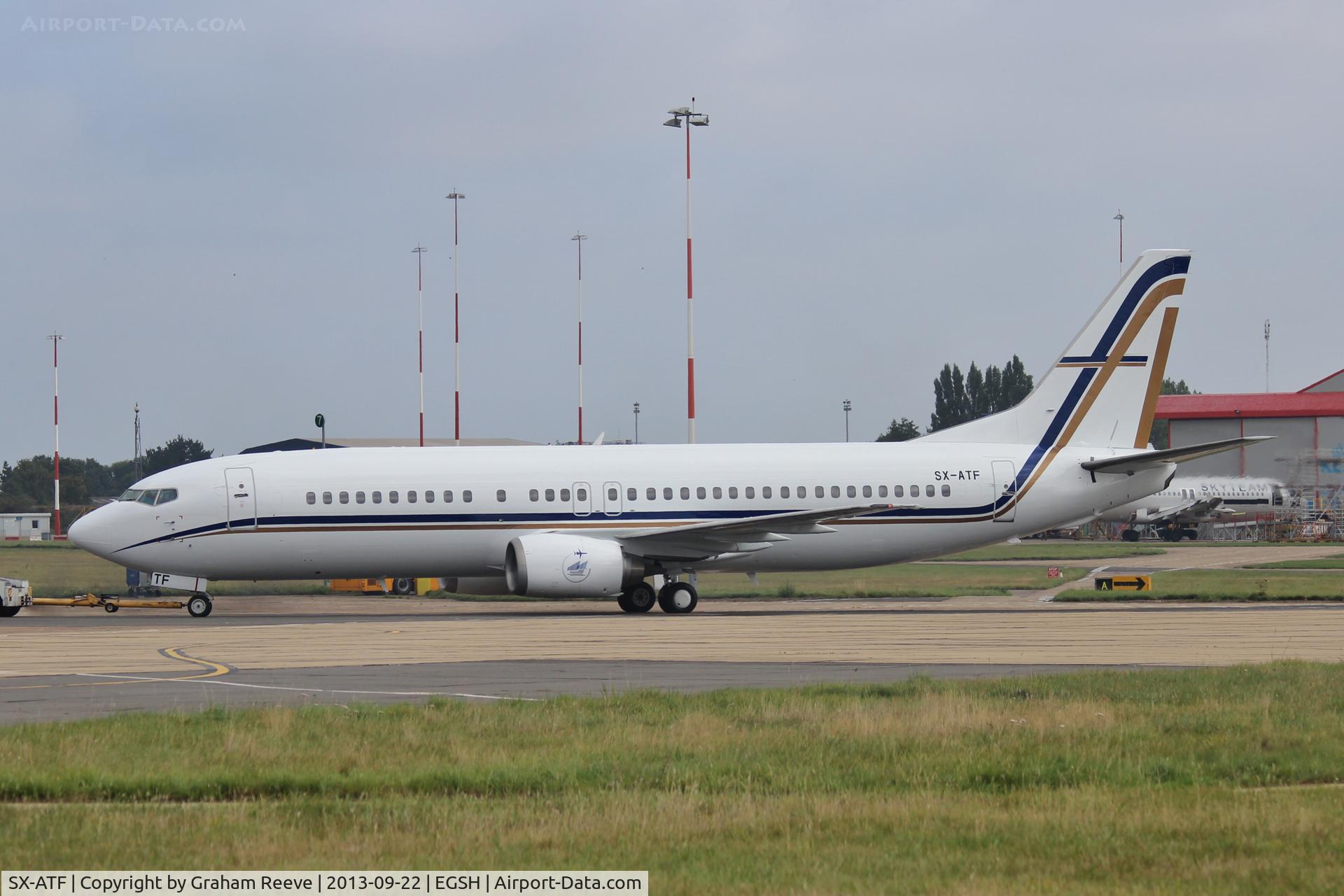SX-ATF, 1992 Boeing 737-406 C/N 25423, Under tow prior to departure.
