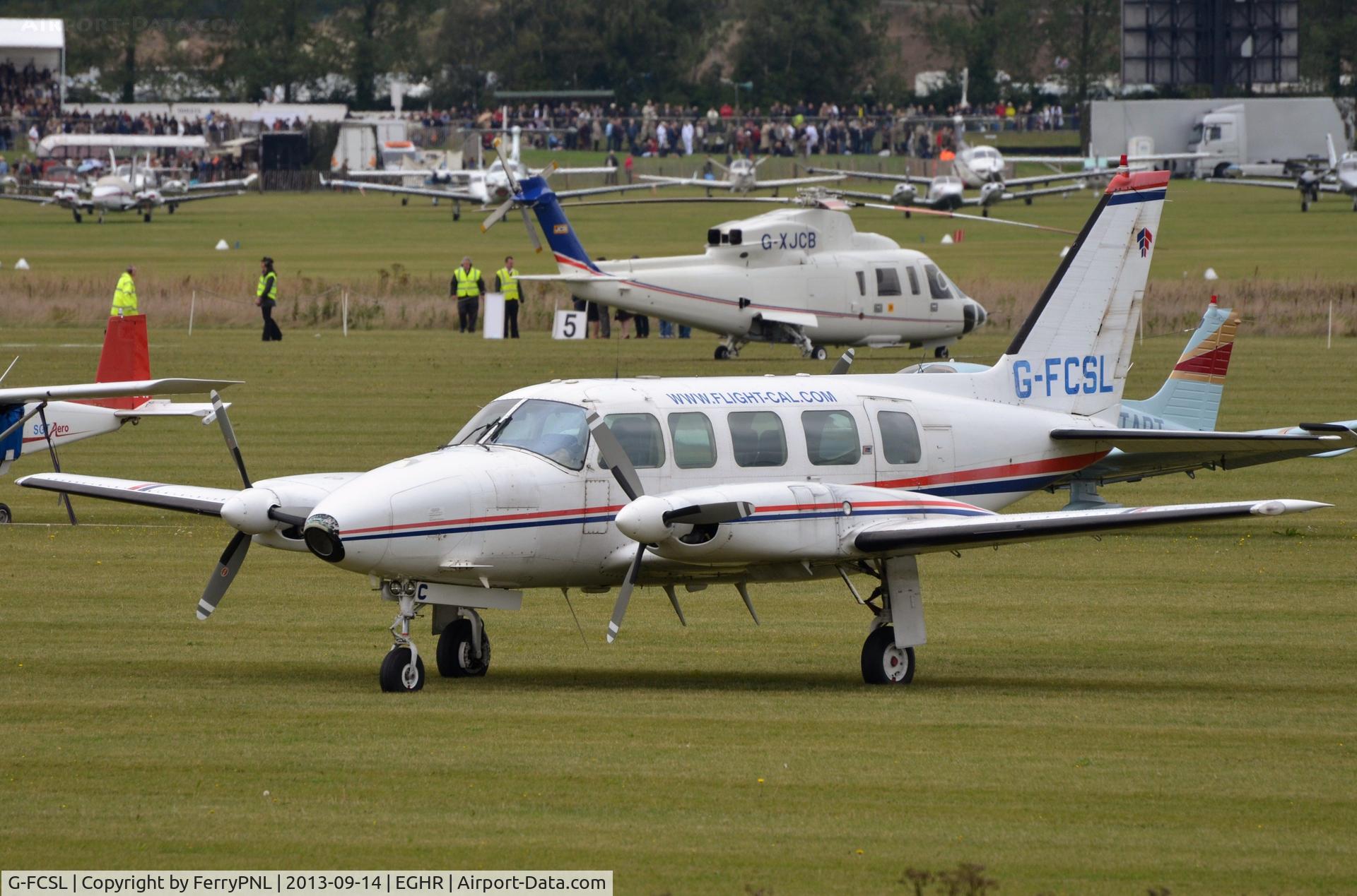 G-FCSL, 1972 Piper PA-31-350 Chieftain C/N 31-7852052, PA31 Chieftain parked at the Goodwood Revival 2013. It still wears the color scheme of former owner Quick Airways. Logo on its tail and 