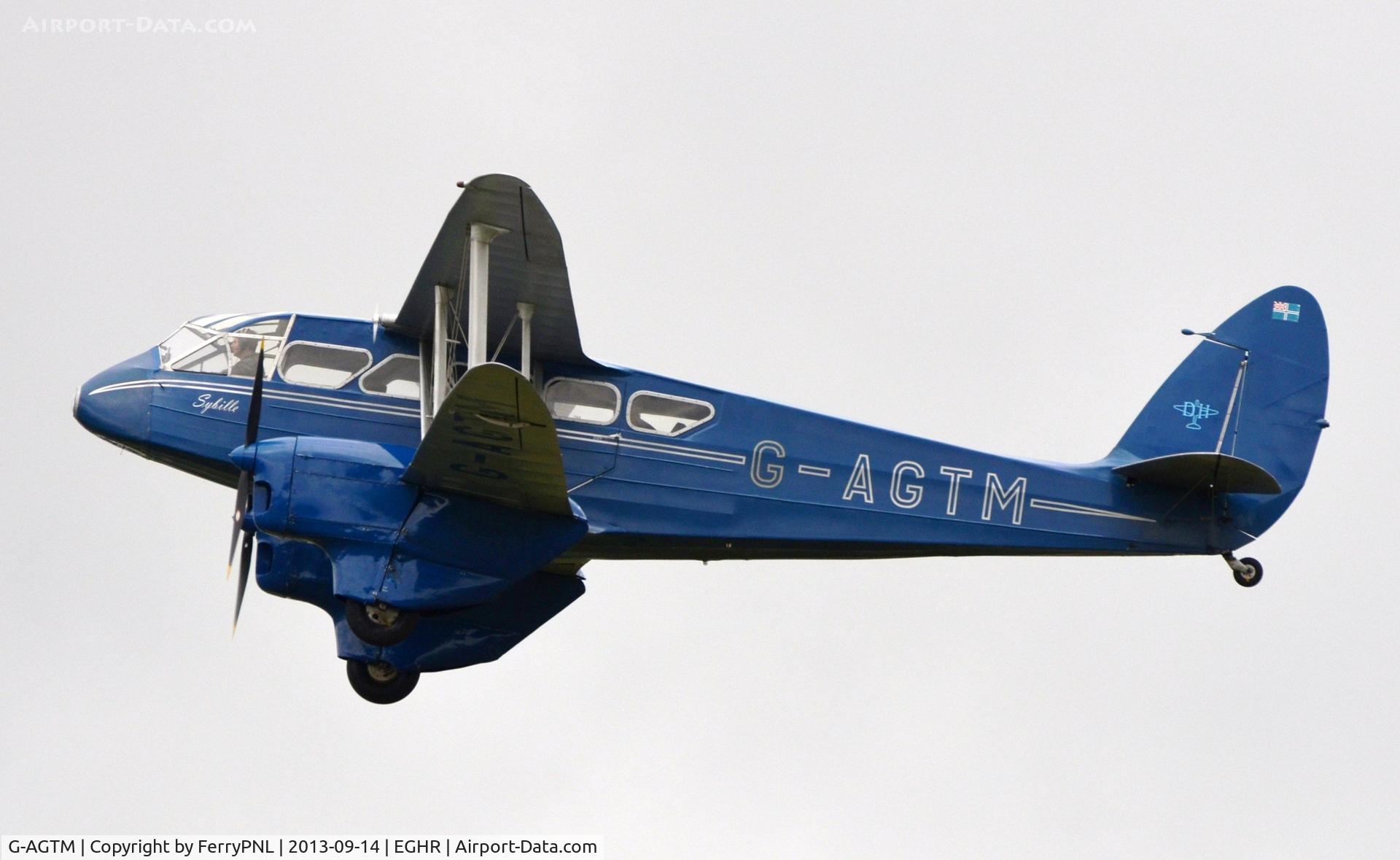 G-AGTM, 1944 De Havilland DH-89A Dominie/Dragon Rapide C/N 6746, Dragon Rapide taking-off at Goodwood during Revival weekend 2013.