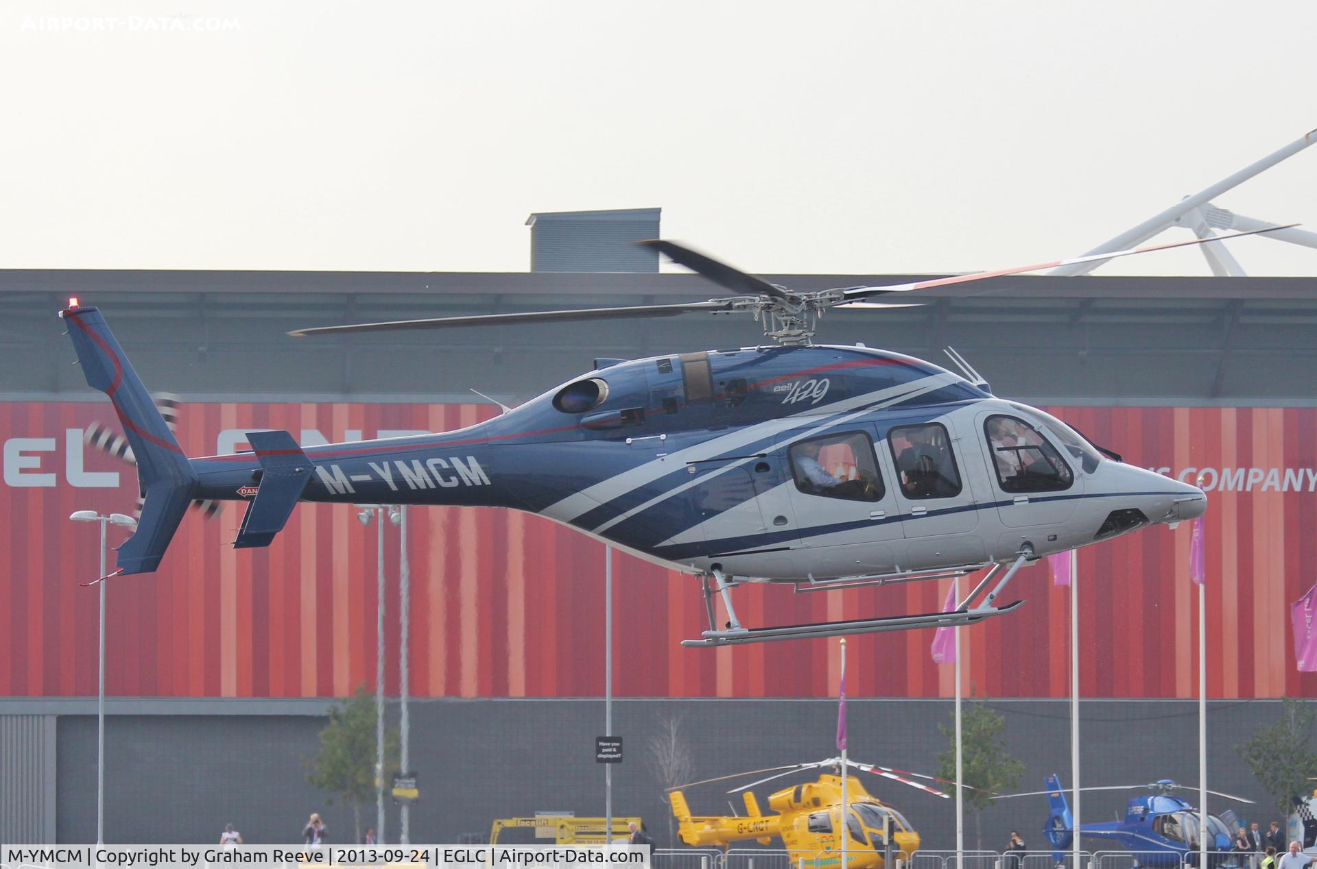M-YMCM, 2012 Bell 429 GlobalRanger C/N 57107, Coming into land at Helitech 2013 at the ExCel centre next to London City Airport.